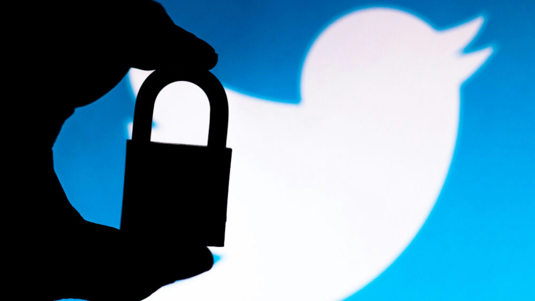 BRAZIL - 2020/07/11: In this photo illustration a padlock appears next to the Twitter logo. Online data protection/breach concept. Internet privacy issues.