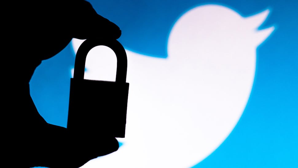 BRAZIL - 2020/07/11: In this photo illustration a padlock appears next to the Twitter logo. Online data protection/breach concept. Internet privacy issues.