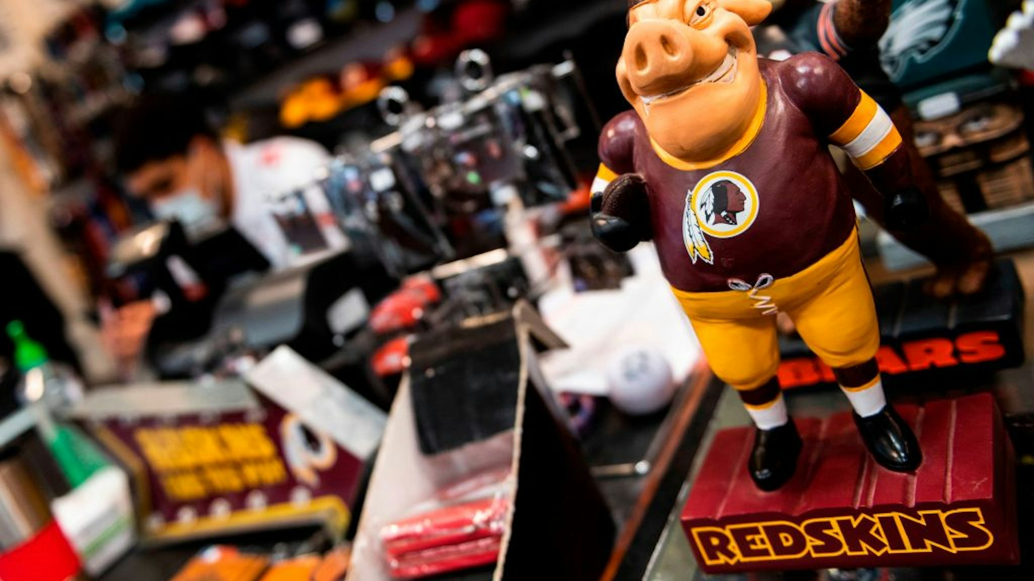 Washington Redskins merchandise is seen for sale at a sports store in Fairfax, Virginia on July 13, 2020. - The Washington Redskins confirmed on July 13 that the team is changing its name following pressure from sponsors over a word widely criticized as a racist slur against Native Americans. (Photo by ANDREW CABALLERO-REYNOLDS / AFP)