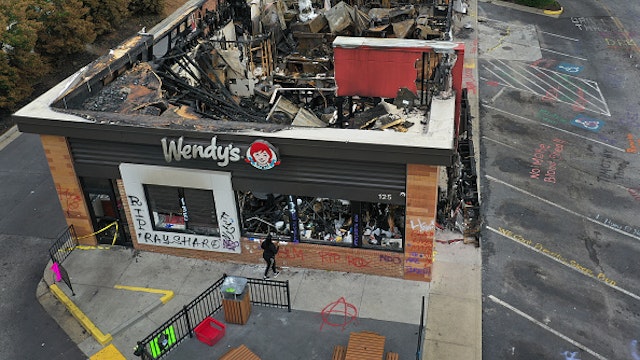 ATLANTA, GEORGIA - JUNE 17: In this aerial photo, the Wendy's restaurant that was set on fire by demonstrators after Rayshard Brooks was killed is seen on June 17, 2020 in Atlanta, Georgia. The site has become a place of remembrance for Mr. Brooks, who was killed by police while fleeing after a struggle during a field sobriety test in the Wendy's parking lot.