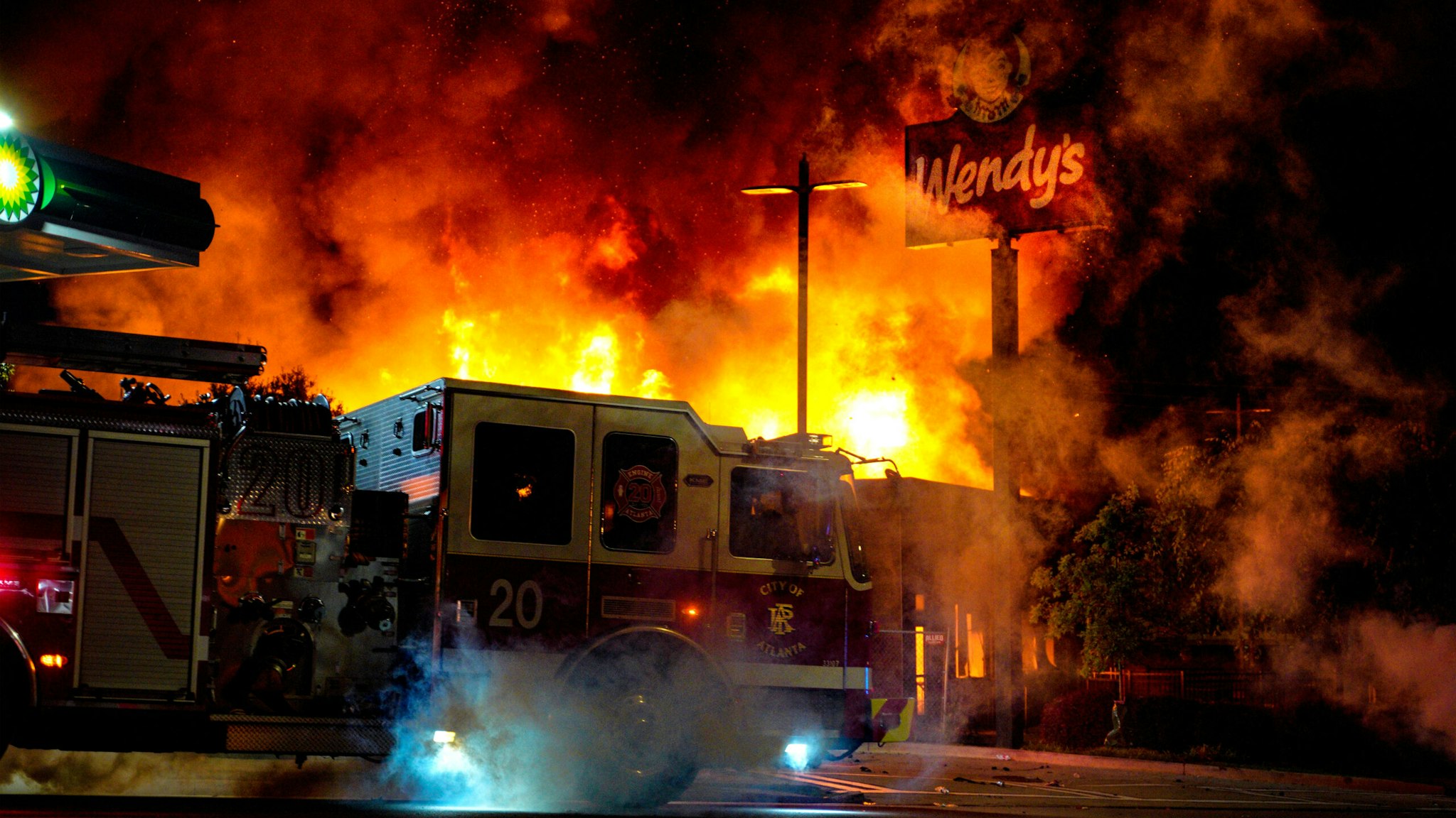 ATLANTA, USA - JUNE 13: Demonstrators set on fire a restaurant during the protest after an Atlanta police officer shot and killed Rayshard Brooks, 27, at a Wendy's fast food restaurant drive-thru Friday night in Atlanta, United States on June 13, 2020. As nationwide protests slowed in the death of George Floyd, anger again erupted Saturday in the US over the fatal shooting of another black man. Mayor Keisha Lance Bottoms announced Atlanta Police Chief Ericka Shields voluntarily stepped down from the department earlier in the day.