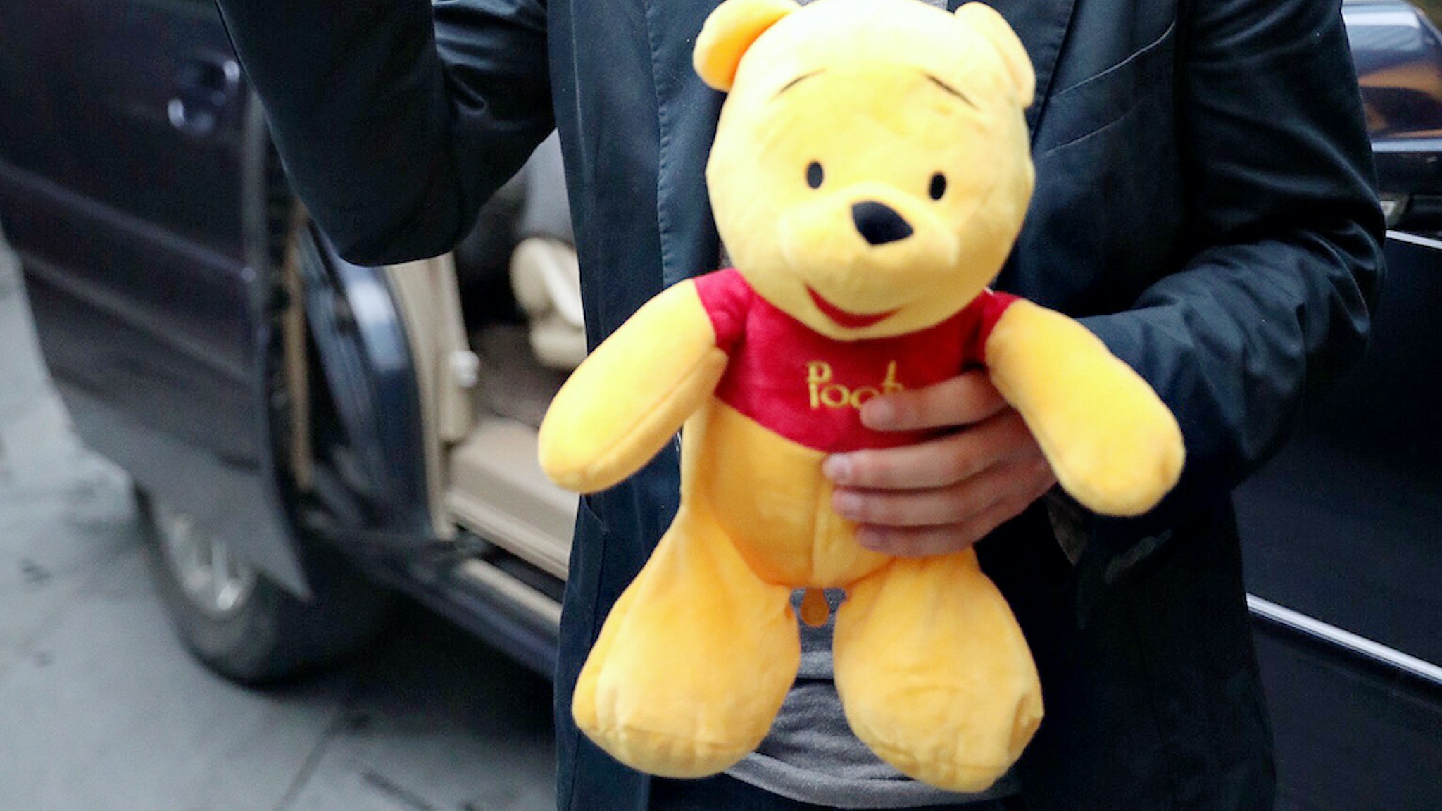 American actor Jesse Eisenberg holding a Pooh Bear toy given by fans is seen on June 30, 2018 in Shanghai, China. (Photo by Visual China Group via Getty Images)