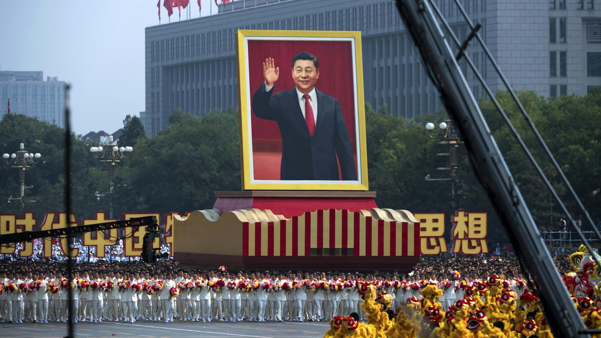 70th Anniversary Of The Founding Of The People’s Republic Of China – Military Parade & Mass Pageantry A giant portrait of Chinese President Xi Jinping is carried atop a float at a parade to celebrate the 70th Anniversary of the founding of the People's Republic of China in 1949 , at Tiananmen Square on October 1, 2019 in Beijing, China.