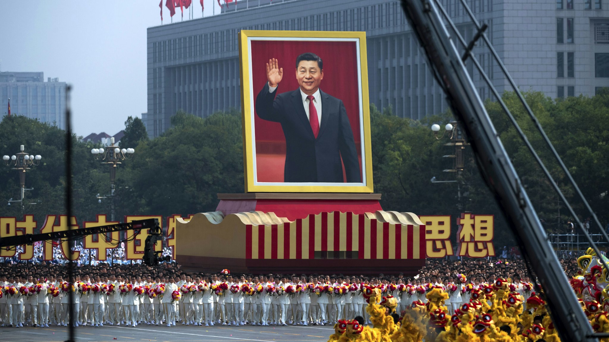A giant portrait of Chinese President Xi Jinping is carried atop a float at a parade to celebrate the 70th Anniversary of the founding of the People's Republic of China in 1949 , at Tiananmen Square on October 1, 2019 in Beijing, China.
