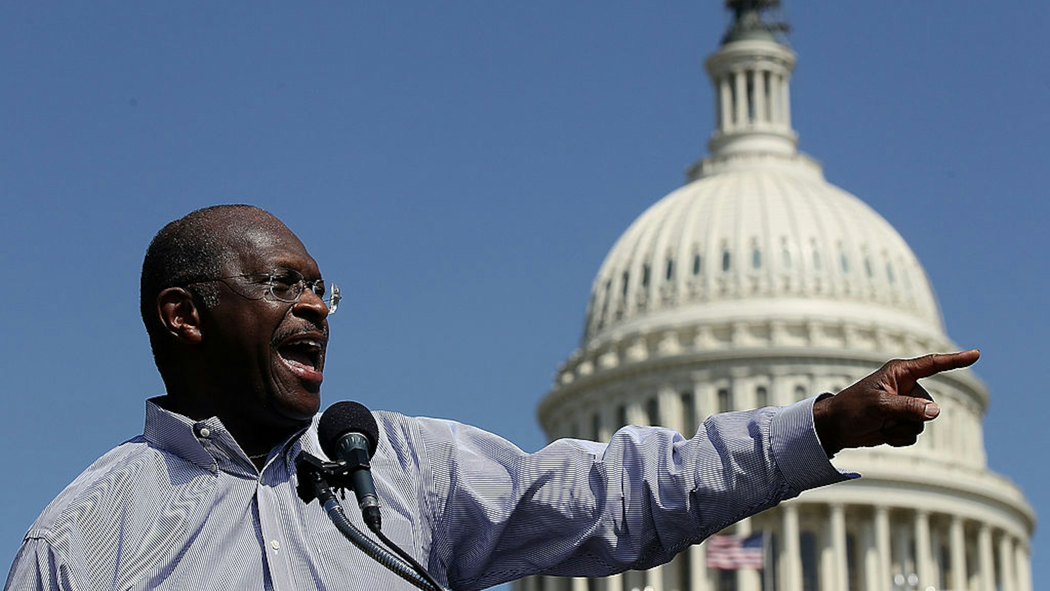 WASHINGTON, DC - APRIL 16: Former Republican presidential candidate Herman Cain speaks at the "Cain's Revolution on the Hill" Tax Day Rally at the U.S. Capitol April 16, 2012 in Washington, DC. Cain spent the day promoting his 9-9-9 tax code plan in advance of tomorrow, the day that Americans are required to file their income taxes this year. (Photo by