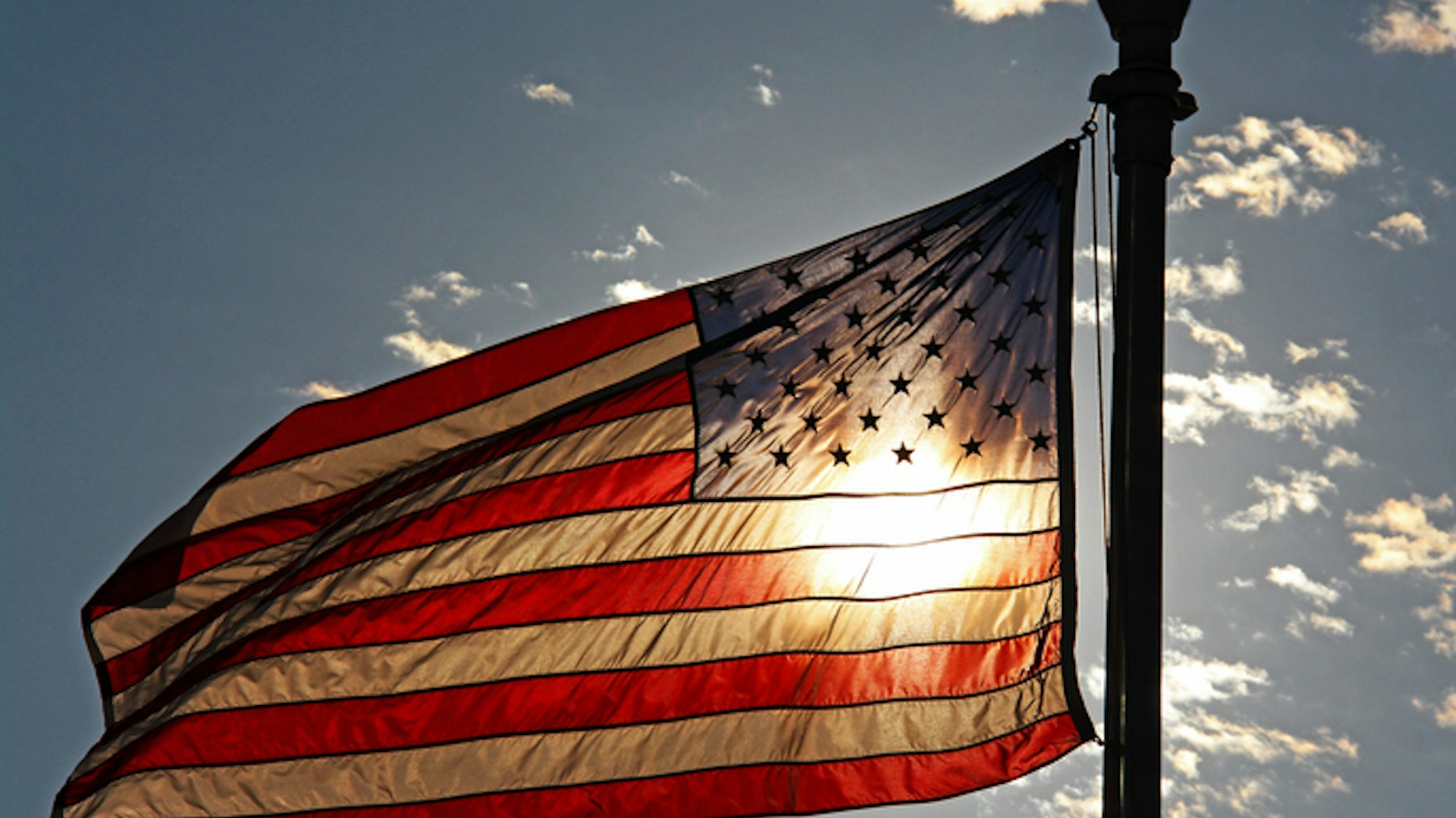 Sun highlights the colors of the american flag.