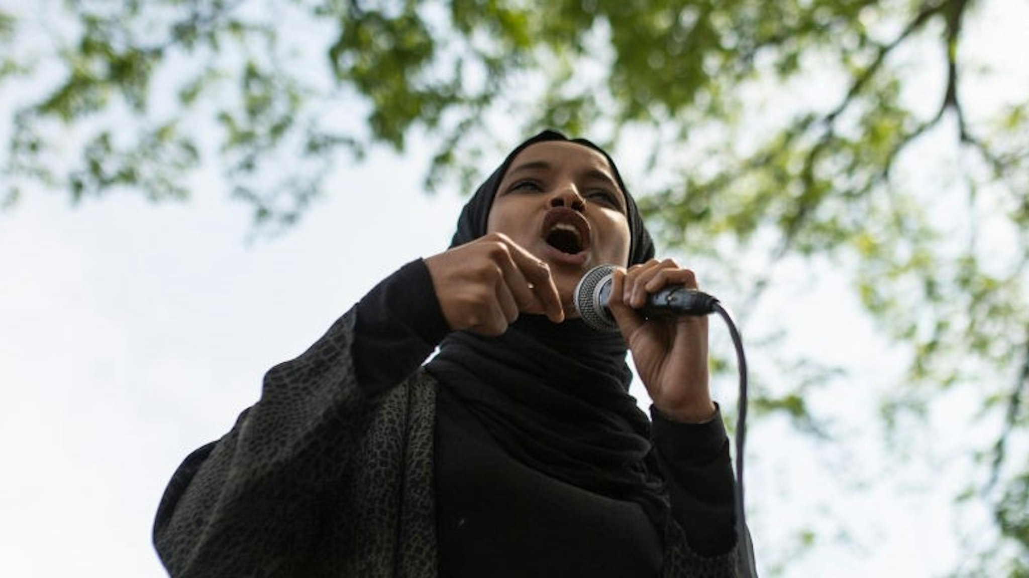 Rep. Ilhan Omar (D-MN) speaks to a crowd gathered for a march to defund the Minneapolis Police Department on June 6, 2020 in Minneapolis, Minnesota. The march commemorated the life of George Floyd who was killed by members of the MPD on May 25. (Photo by