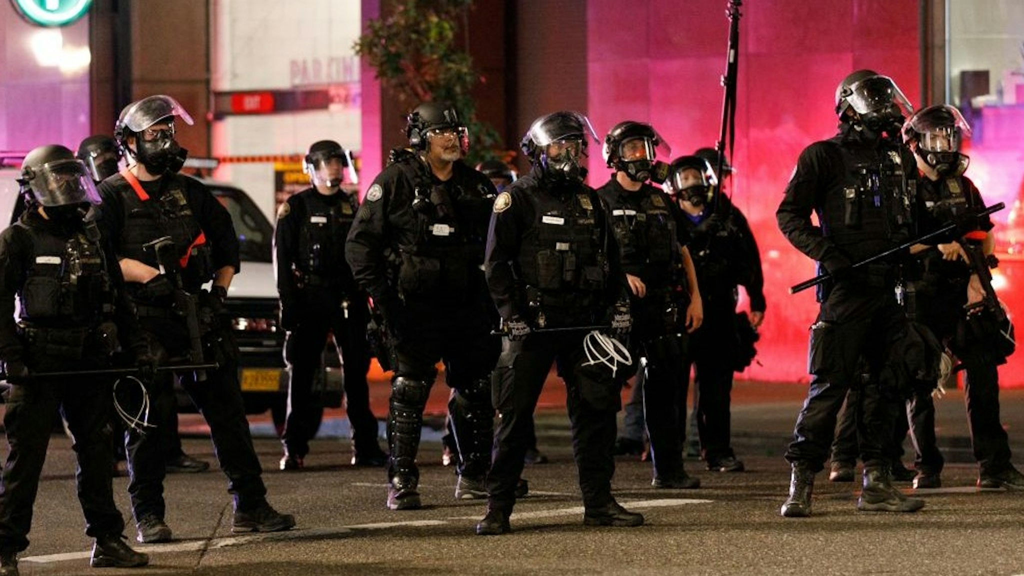 Police confront demonstrators as Black Lives Matter supporters demonstrate in Portland, Oregon on July 4, 2020 for the thirty-eighth day in a row at Portland's Justice Center and throughout Portland, with a riot declared about 12.20 am on July 5. CS tear gas and less-lethal weapons were used, and multiple arrests were made. (Photo by