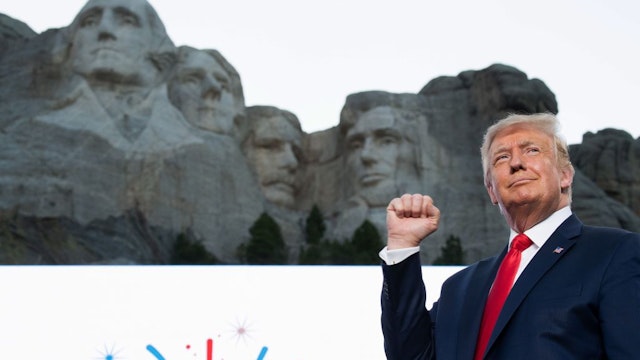 US President Donald Trump pumps his fist as he arrives for the Independence Day events at Mount Rushmore National Memorial in Keystone, South Dakota, July 3, 2020. (Photo by SAUL LOEB / AFP) (Photo by