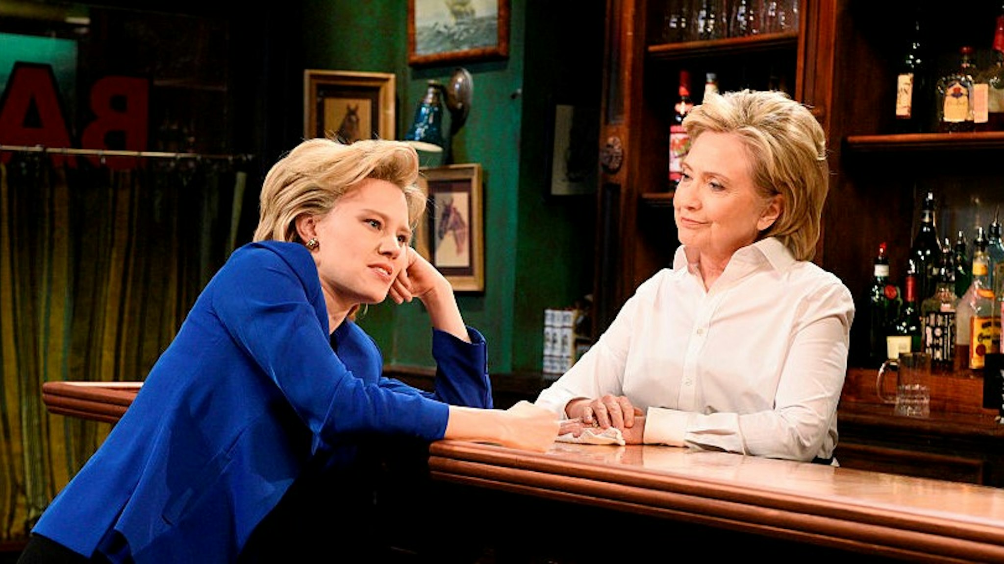 SATURDAY NIGHT LIVE -- "Miley Cyrus" Episode 1684 -- Pictured: (l-r) Kate McKinnon as Hillary Clinton and Hillary Clinton as Val during the "Bar Talk" sketch on October 3, 2015 -- (Photo by: