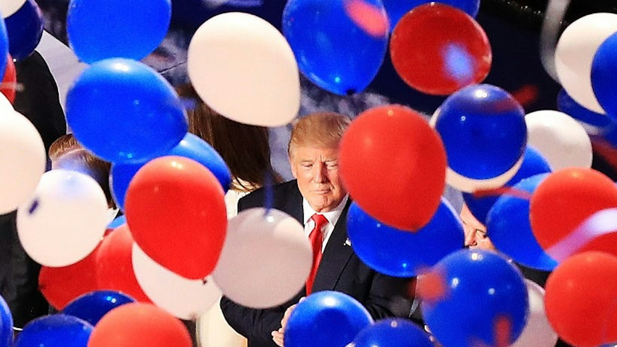 CLEVELAND, OH - JULY 21: Republican presidential candidate Donald Trump and his family acknowledge the crowd as balloons fall on the fourth day of the Republican National Convention on July 21, 2016 at the Quicken Loans Arena in Cleveland, Ohio. Republican presidential candidate Donald Trump received the number of votes needed to secure the party's nomination. An estimated 50,000 people are expected in Cleveland, including hundreds of protesters and members of the media. The four-day Republican National Convention kicked off on July 18. (Photo by