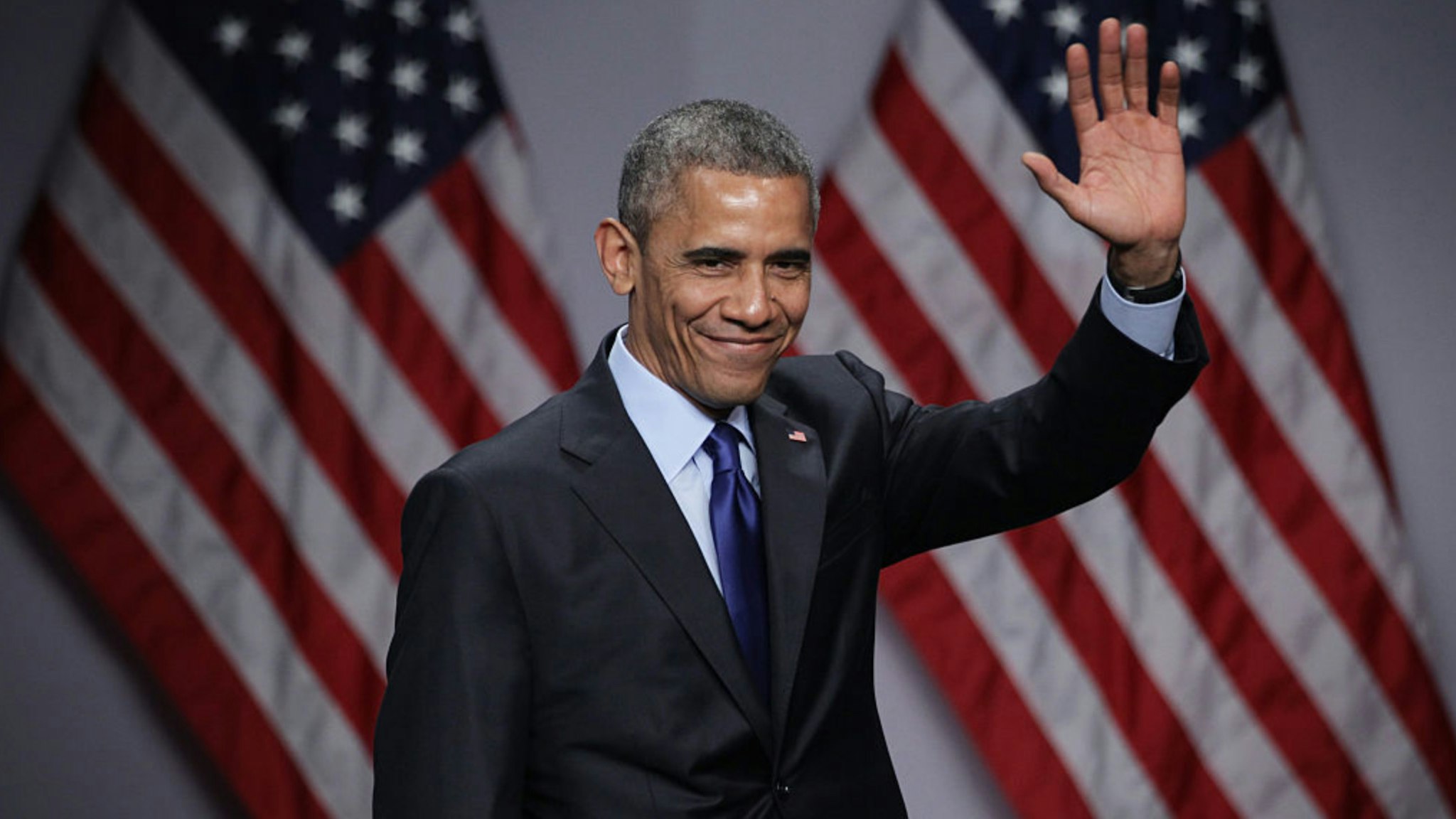 U.S. President Barack Obama waves after he spoke during the SelectUSA Investment Summit March 23, 2015 in National Harbor, Maryland.