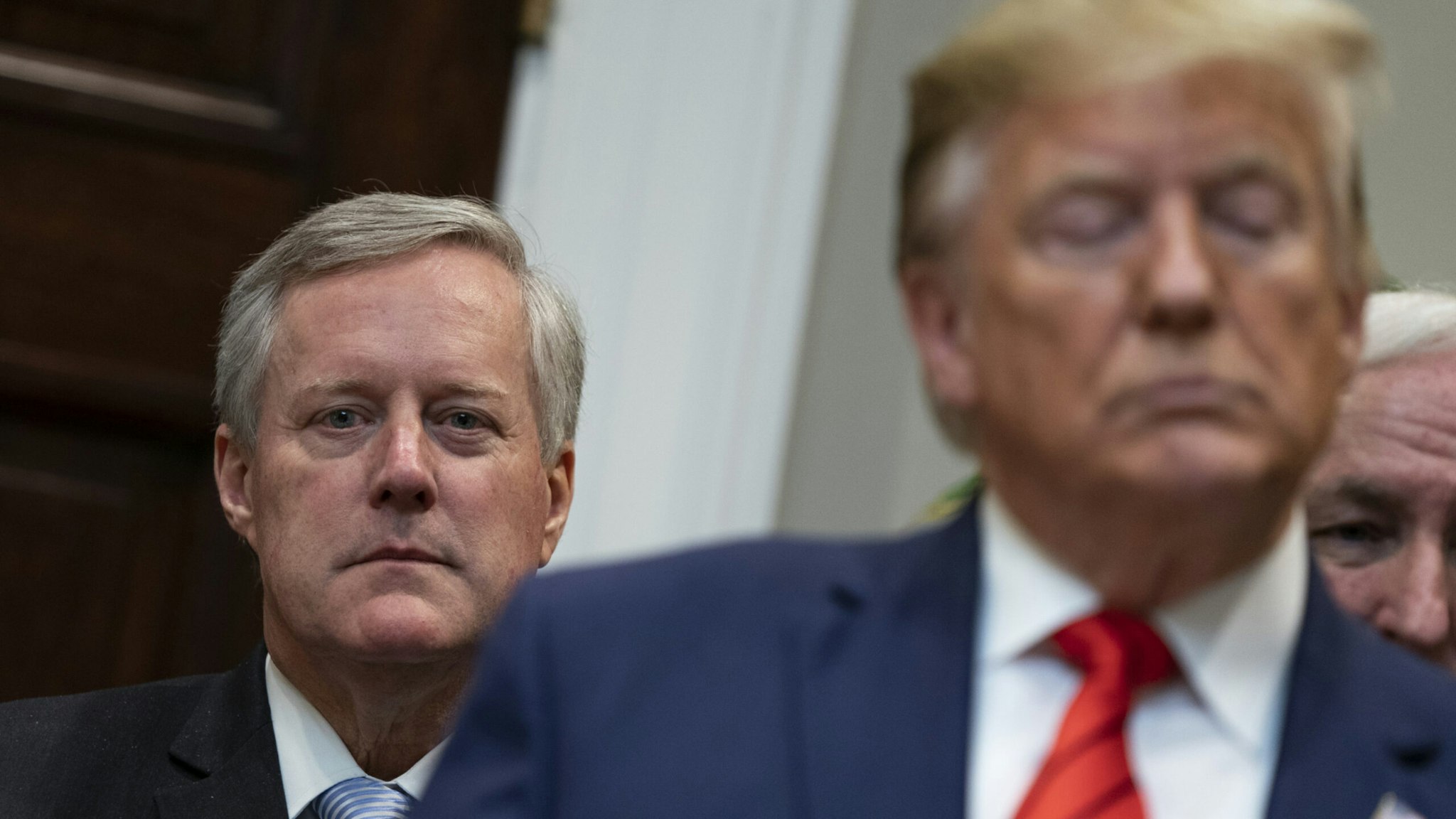 Representative Mark Meadows, a Republican from North Carolina, left, listens during an executive order signing event with U.S. President Donald Trump in the Roosevelt Room of the White House in Washington, D.C., U.S., on Wednesday, October 9, 2019.