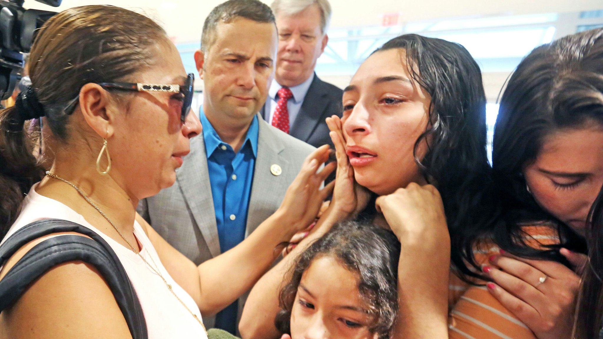 Alejandra Juarez, 38, left, has an emotional goodbye on Friday, Aug. 3, 2018, with her children, Pamela,16, Estela, 8, and Katie Aragon, right, of FWD.US at the Orlando International Airport. U.S Rep Darren Soto, second from left, looks on. Juarez has run out of options to keep her Davenport, Fla., family together and will be deported as U.S. Immigration and Customs Enforcement officials denied the Polk County Marine veteran's wife stay of removal request last week.