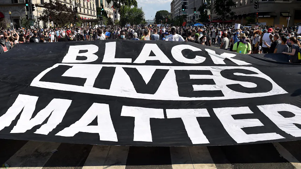 us-politics-race-unrest Demonstrators deploy a " Black Lives Matter" banner near the White House during a demonstration against racism and police brutality, in Washington, DC on June 6, 2020. - Demonstrations are being held across the US following the death of George Floyd on May 25, 2020, while being arrested in Minneapolis, Minnesota.