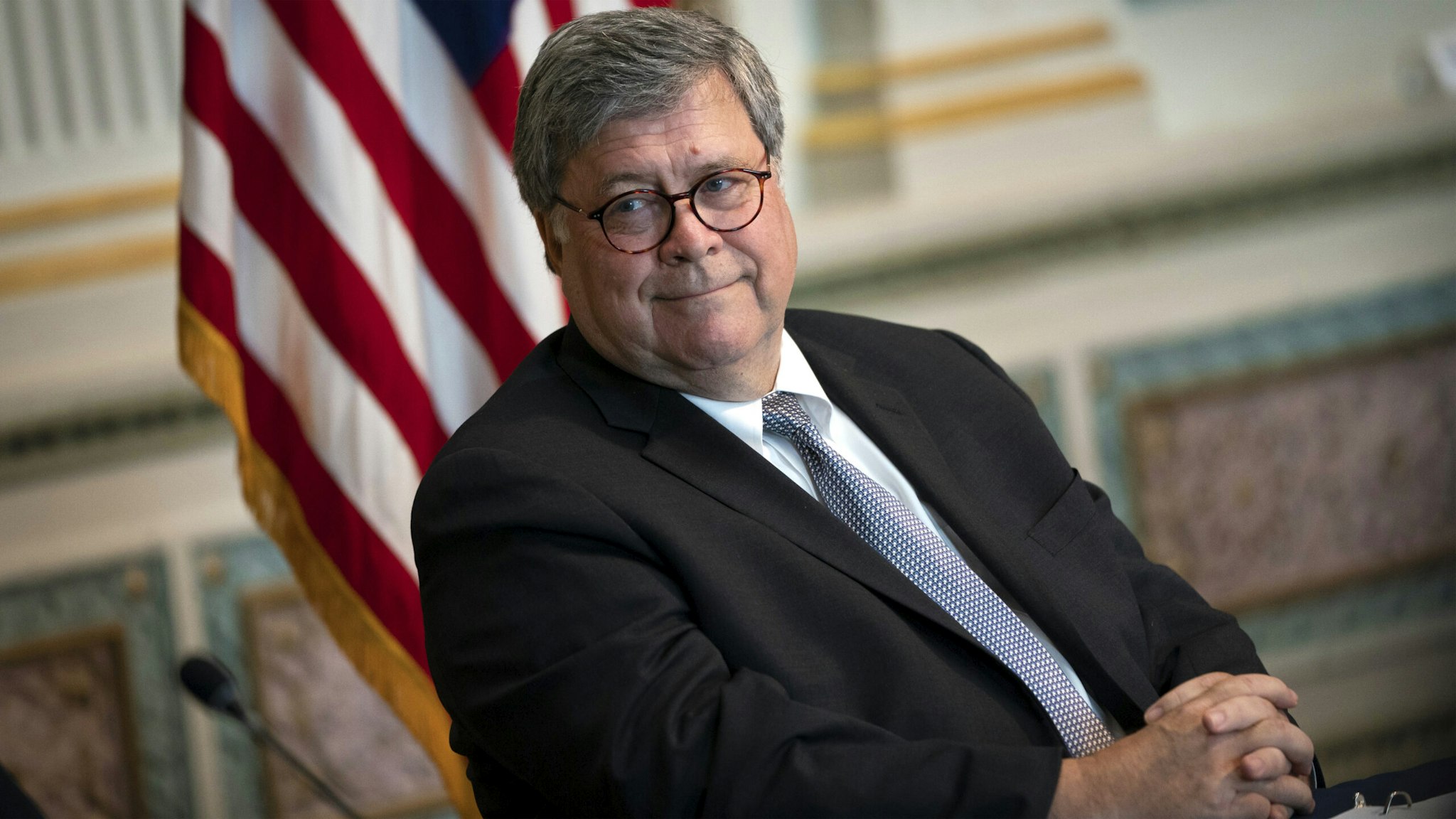 Attorney General William Barr listens during an event to highlight the Department of Justice grants to combat human trafficking, in the Indian Treaty Room of the Eisenhower Executive Office Building on August 4, 2020 in Washington, DC. The Trump administration is issuing more than $35 million in grants to provide safe housing to survivors of human trafficking.