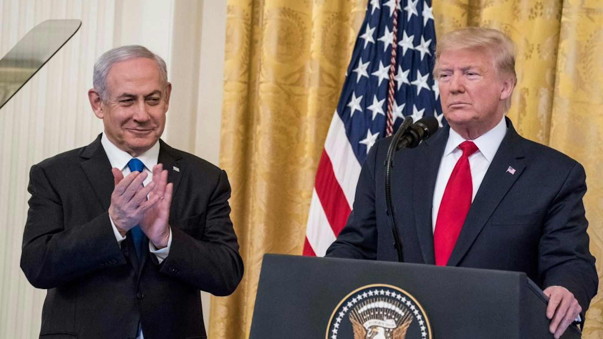 WASHINGTON, DC - JANUARY 28: U.S. President Donald Trump and¬†Israeli Prime Minister Benjamin Netanyahu¬†participate in a joint statement in the East Room of the White House on January 28, 2020 in Washington, DC. The news conference was held to announce the Trump administration's plan to resolve the Israeli-Palestinian conflict. (Photo by Sarah Silbiger/Getty Images)