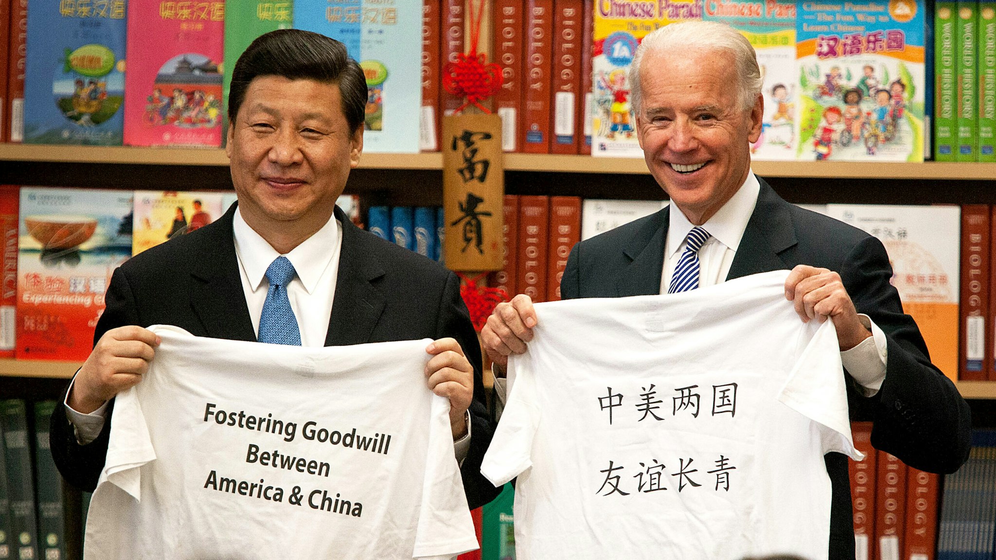Xi Jinping, vice president of China, left, and U.S. Vice President Joe Biden stand for a photograph while visiting the International Studies Learning Center in South Gate, California, U.S., on Friday, Feb. 17, 2012. Xi wraps us his trip to the U.S. today and will fly to Ireland for an official visit and then to Turkey to meet with Minister Recep Tayyip Erdogan in Ankara on Feb. 21 before returning to China.