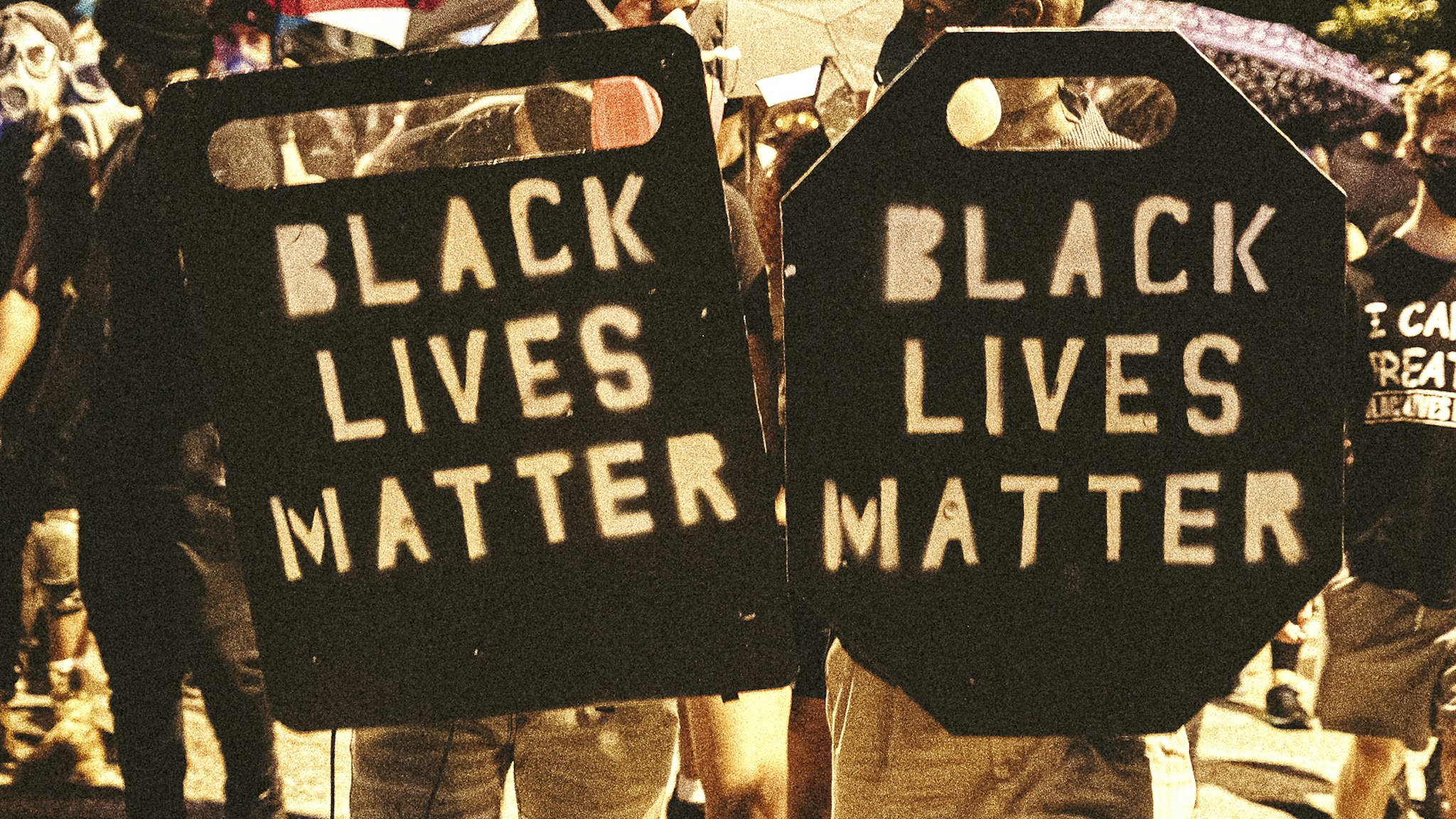 RICHMOND, VA - JULY 25: People carrying homemade Black Lives Matter shields march in front of protesters on July 25, 2020 in Richmond, Virginia. Protesters in Richmond took to the streets to join other protesters around the country for the Stand With Portland rally in support of the Black Lives Matter protesters in Portland, Oregon.