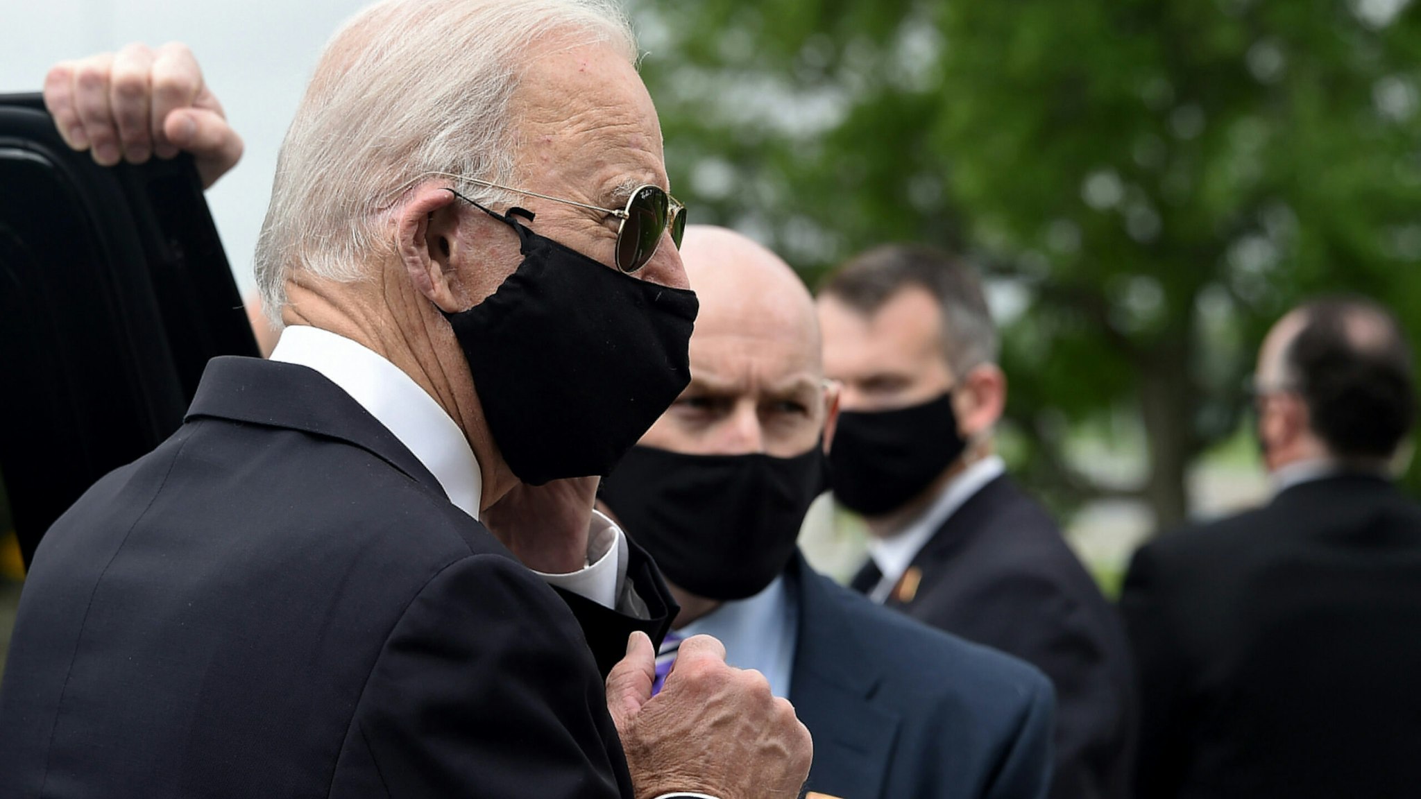 Democratic presidential candidate and former US Vice President Joe Biden (L) departs the Delaware Memorial Bridge Veteran's Memorial Park after paying respects to fallen service members in New Castle, Delaware, May 25, 2020.