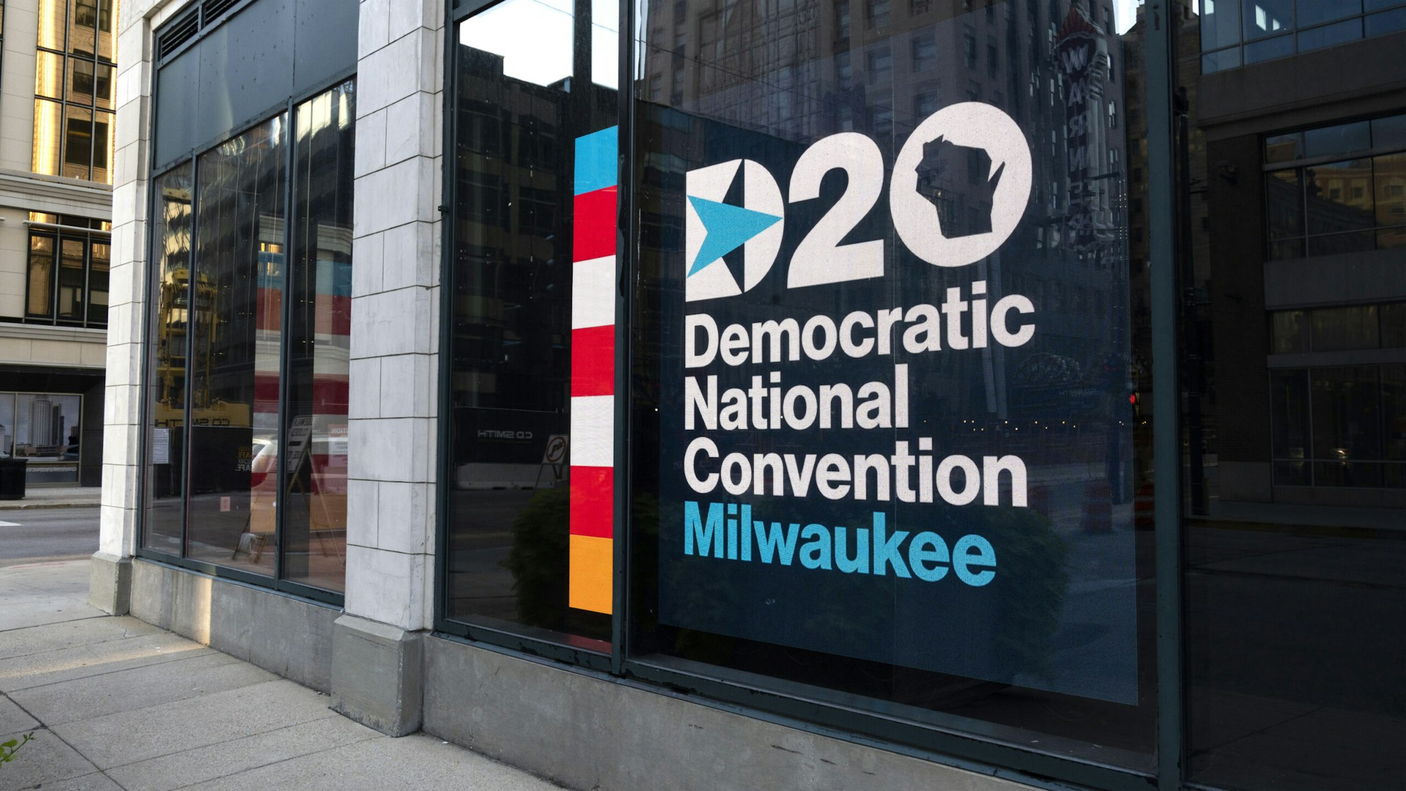 Signage for the Democratic National Convention is displayed near the Wisconsin Center in Milwaukee, Wisconsin, U.S., on Sunday, Aug. 16, 2020. A full slate of Democratic stars will take the virtual stage at the partys convention next week, from one-time presidential candidates, to beloved former officials to up-and-comers.