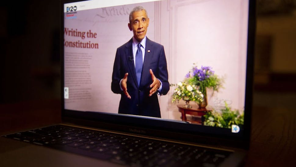 Former U.S. President Barack Obama speaks during the virtual Democratic National Convention seen on a laptop computer in Tiskilwa, Illinois, U.S., on Wednesday, Aug. 19, 2020. The DNC, which began Monday and ends Thursday with Joe Biden accepting the nomination for president, will be almost entirely virtual with speakers delivering addresses from around the U.S. that will be streamed on the internet.