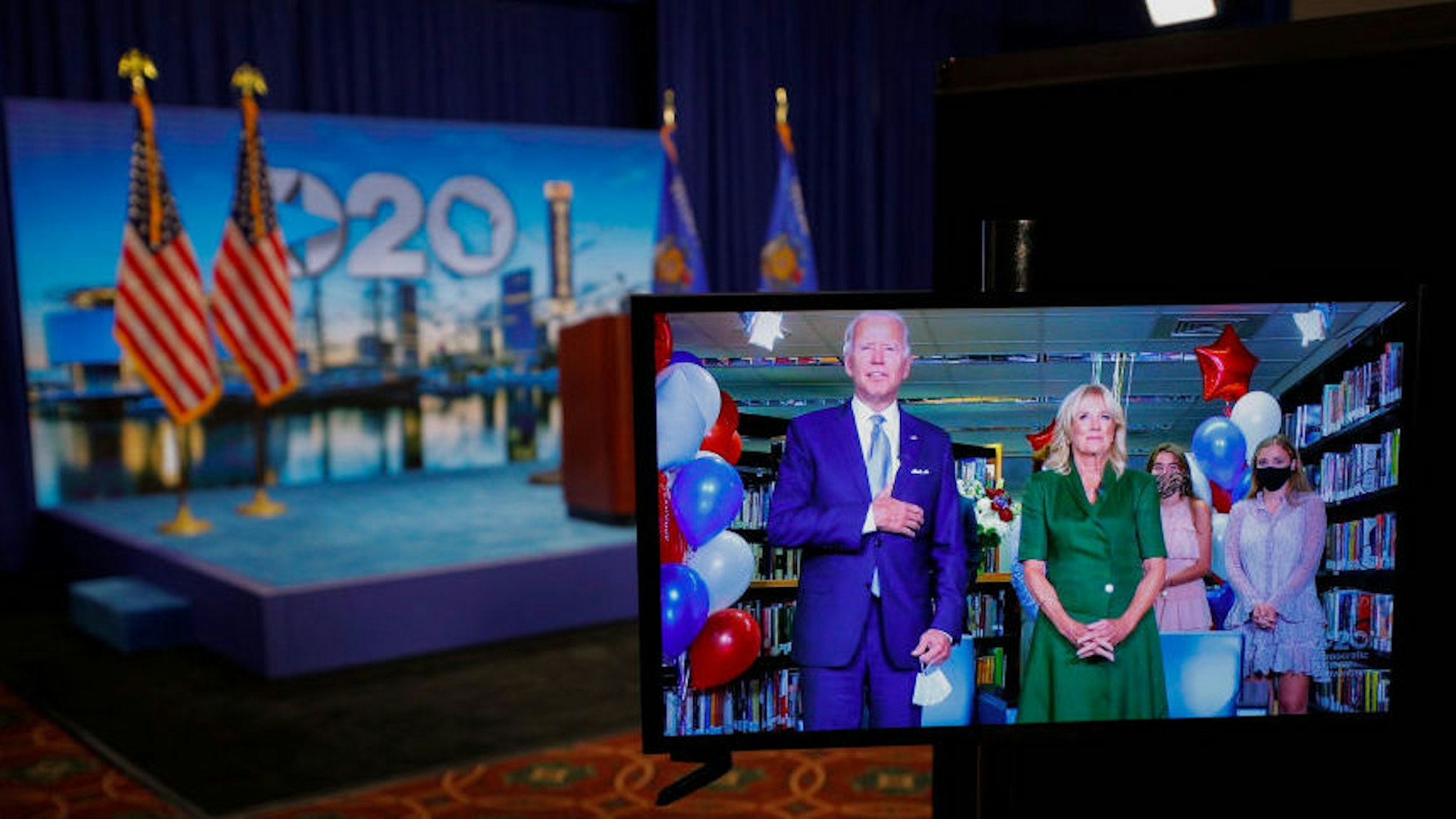 Democratic 2020 presidential nominee and former Vice President Joe Biden is seen in a video feed from Delaware as he reacts with his wife Jill and his grandchildren at his side after winning the votes to become the Democratic Party’s 2020 nominee for president during the second night of the 2020 Democratic National Convention as seen at the Wisconsin Center in Milwaukee, Wisconsin, U.S., August 18, 2020. REUTERS/Brian Snyder/Pool