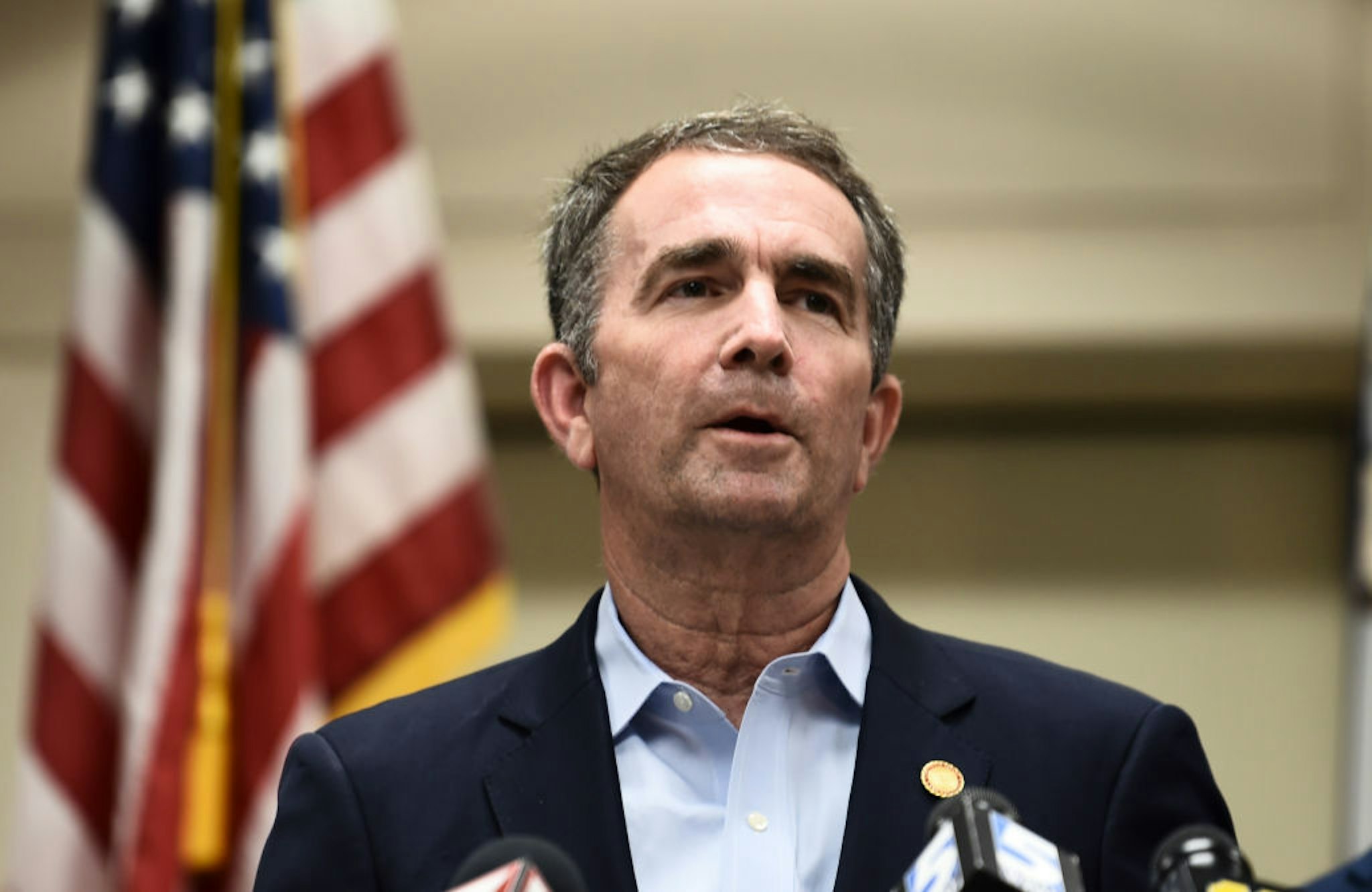 Virginia Governor Ralph Northam speaks to the press about a mass shooting on June 1, 2019, in Virginia, Beach, Virginia. - A municipal employee sprayed gunfire "indiscriminately" in a government building complex on May 31, 2019, police said, killing 12 people and wounding four in the latest mass shooting to rock the US. (Photo by Eric BARADAT / AFP) (Photo credit should read ERIC BARADAT/AFP via Getty Images)