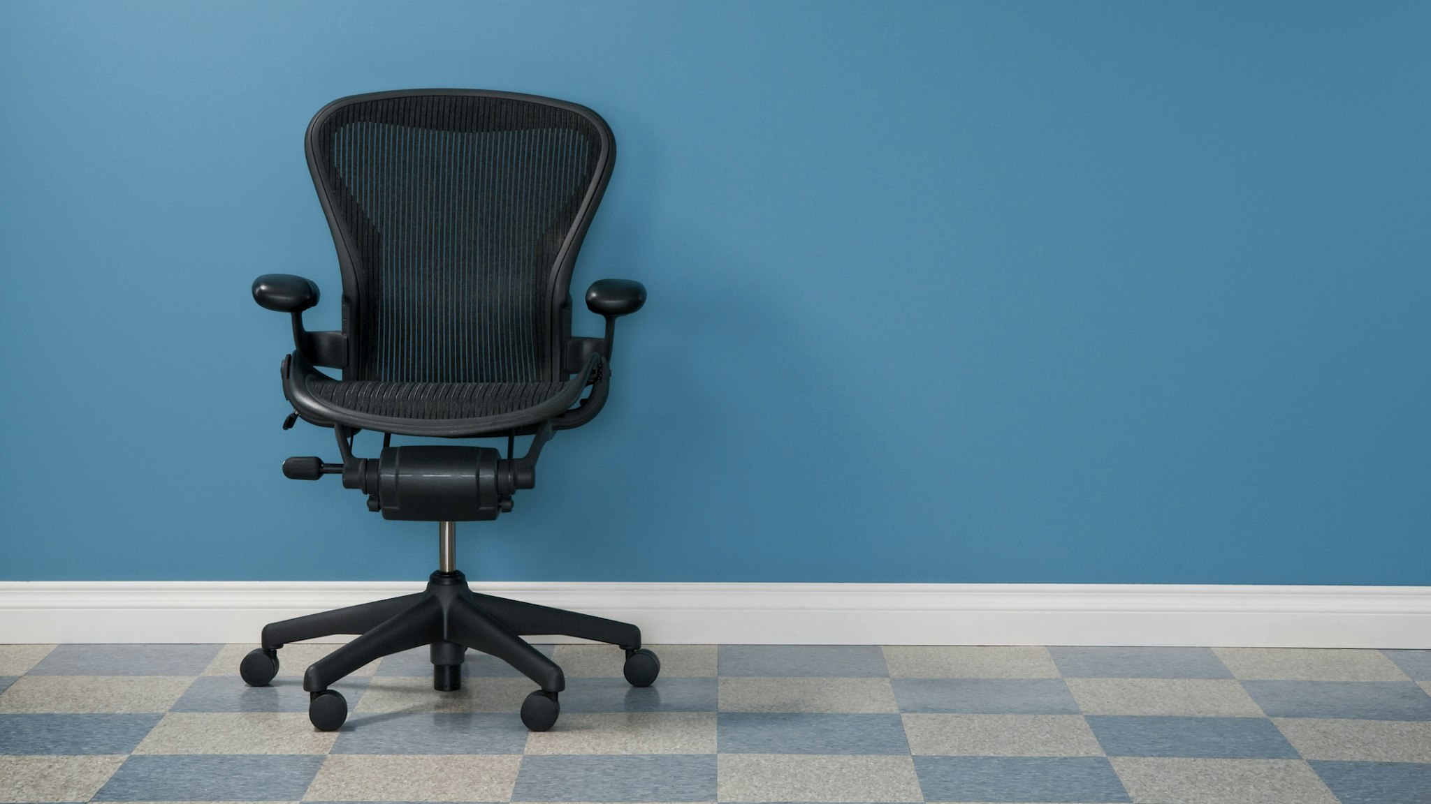 Single office chair in austere office.