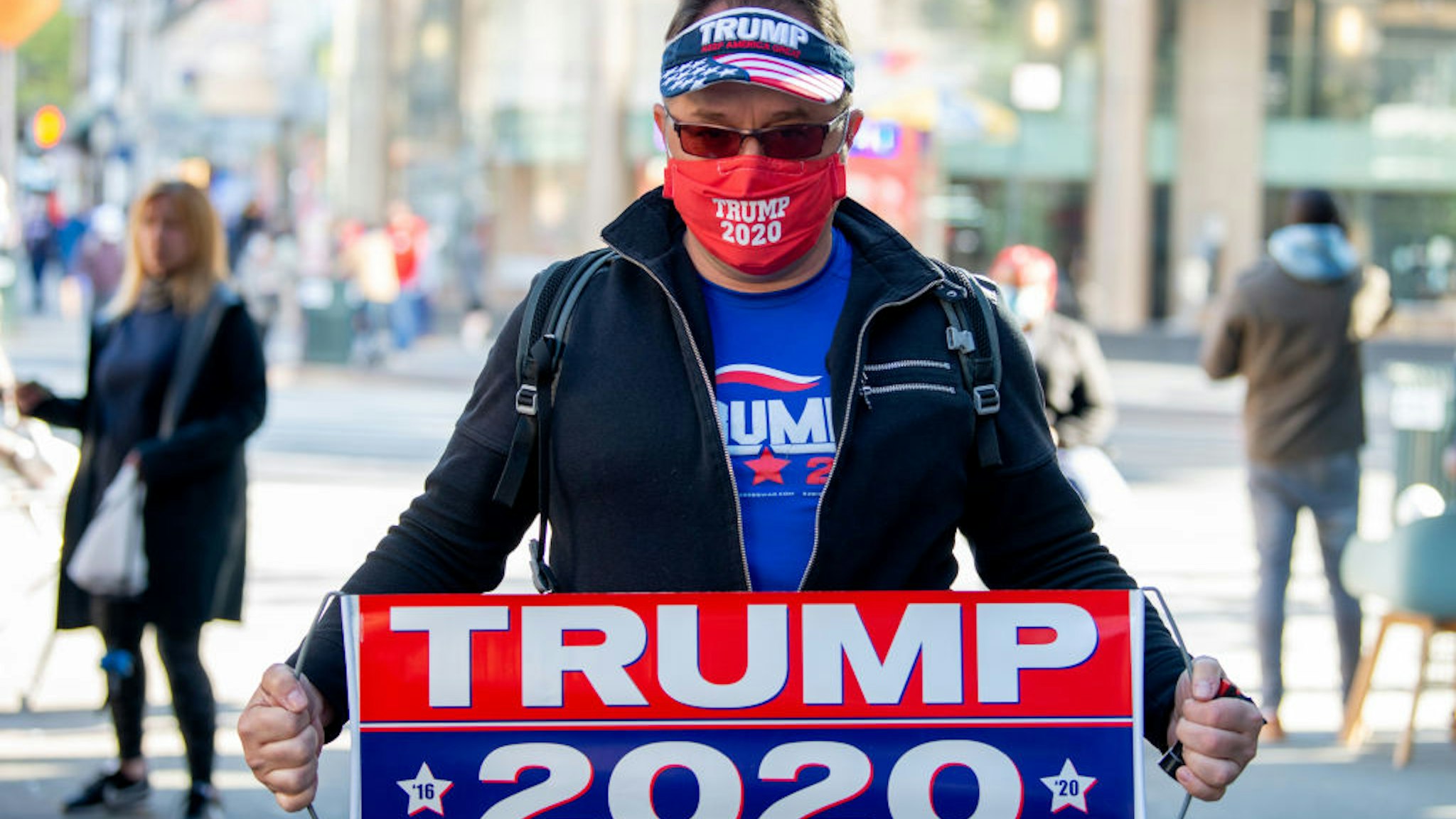 A man wearing a 'Trump 2020' mask and gear poses amid the coronavirus pandemic on May 5, 2020 in New York City. COVID-19 has spread to most countries around the world, claiming over 257,000 lives with over 3.7 million cases.