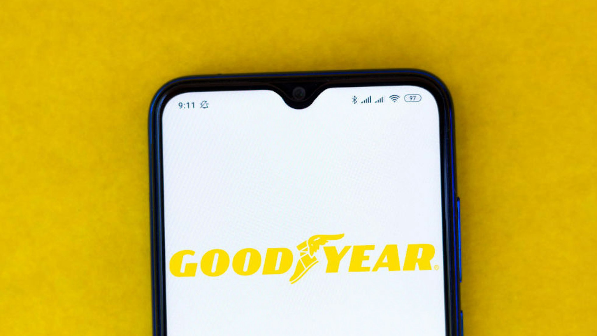 In this photo illustration the Goodyear logo seen displayed on a smartphone.