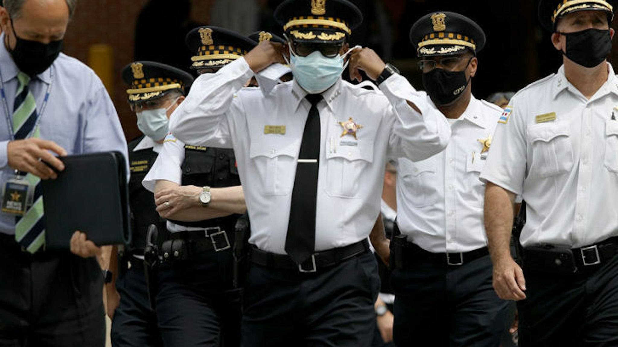 Chicago police Superintendent David Brown, center, walks outside Advocate Illinois Masonic Medical Center to provide information about the police shooting on Thursday, July 30, 2020.