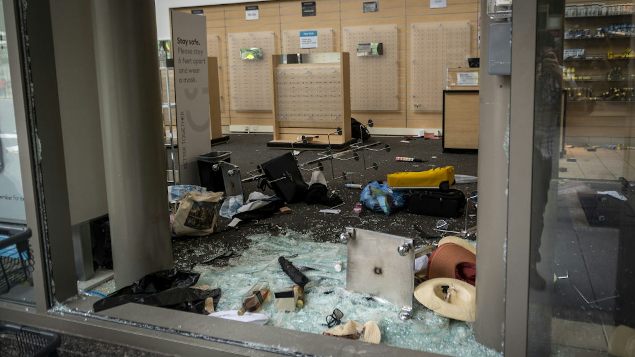 Broken glass and destroyed merchandise displays lay on the ground at a Nordstrom Inc. Rack store following looting on Michigan Avenue in Chicago, Illinois, U.S., on Monday, Aug. 10.
