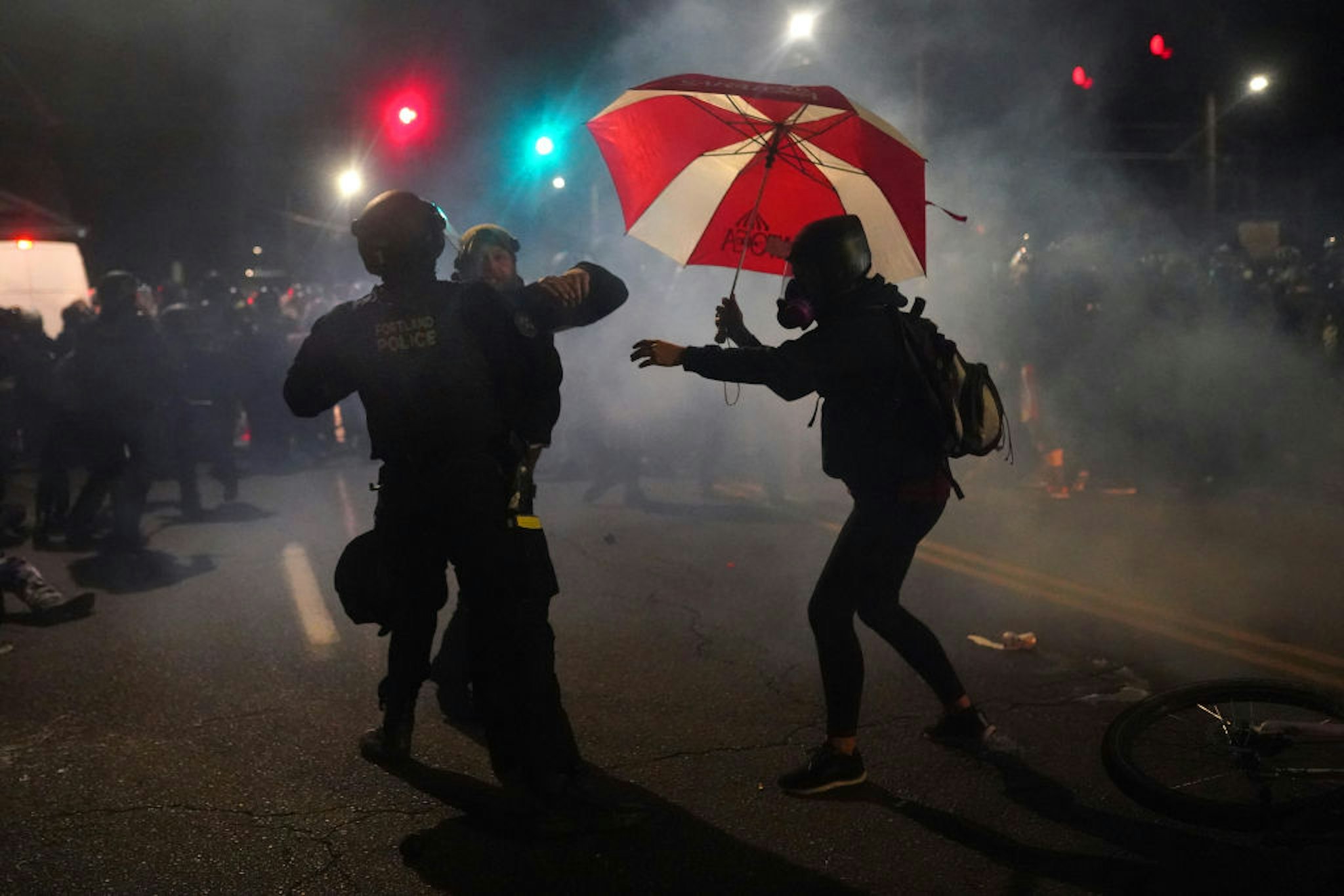 PORTLAND, OR - AUGUST 22: A Portland police officer struggles with a protester while dispersing a crowd from in front of the Multnomah County Sheriffs Office on August 22, 2020 in Portland, Oregon. Hundreds of protesters clashed with police Saturday night following a rally in east Portland. (Photo by Nathan Howard/Getty Images)
