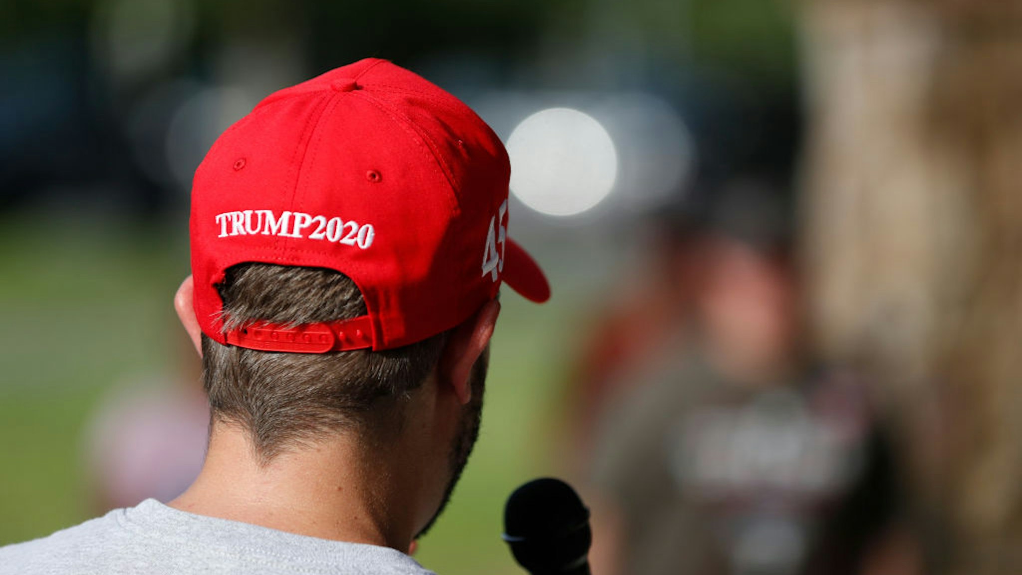 CHARLOTTE, NC - AUGUST 27: A President Donald Trump supporter speaks talks on the microphone during the RNC 2020 Trump Biker Rally & Back the Blue Parade held at Park Road Park on August 27, 2020 in Charlotte, North Carolina. The bike rally for Trump will watch the Republican National Convention at a local sports bar to see President Donald Trump gives his acceptance speech. (Photo by Octavio Jones/Getty Images)