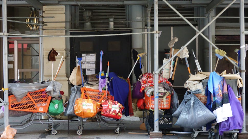 Homeless person living under scaffolding, 20th Street and Fifth Avenue, Manhattan. (Photo by: Joan Slatkin/Education Images/Universal Images Group via Getty Images)