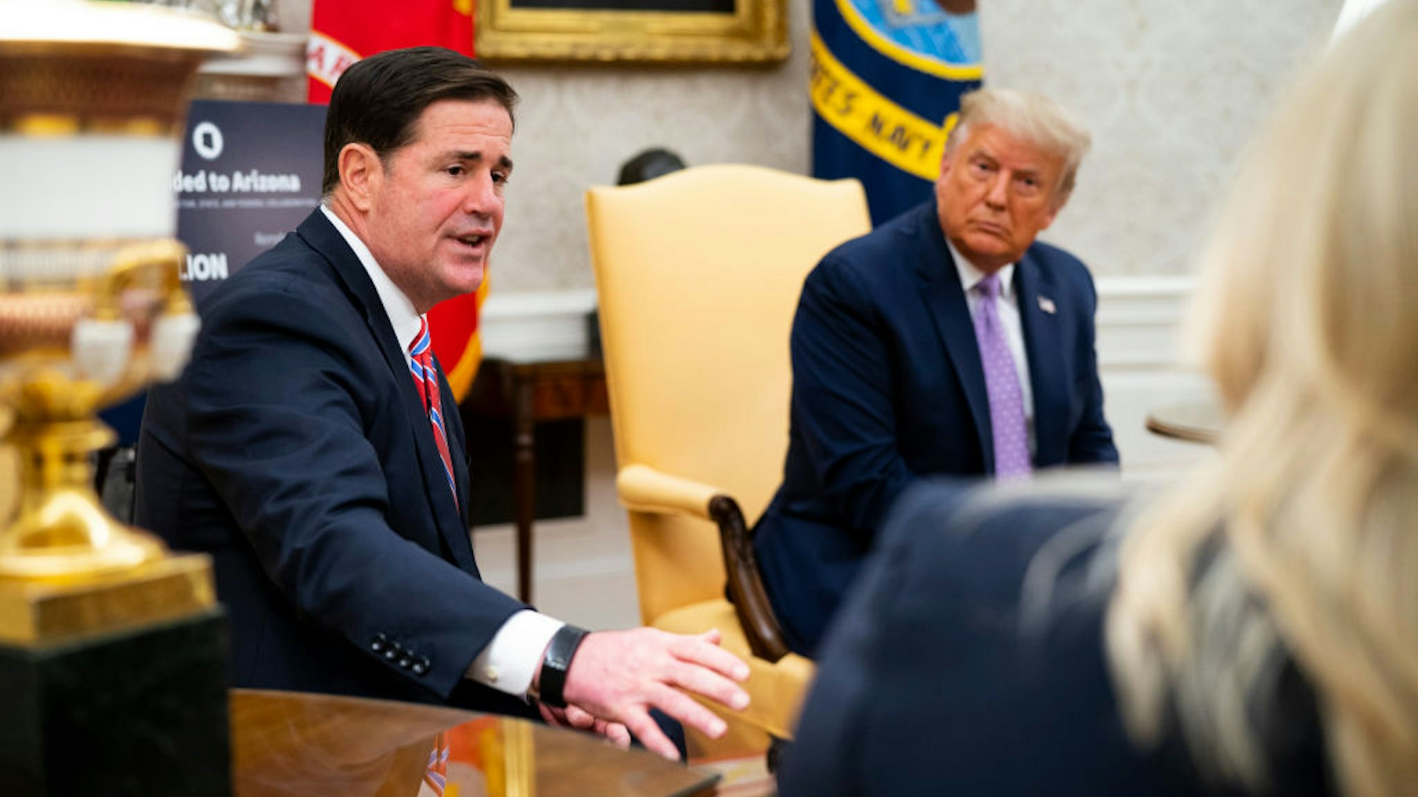 U.S. President Donald Trump meets with Arizona Governor Doug Ducey (L) in the Oval Office of the White House on August 5, 2020 in Washington, DC.