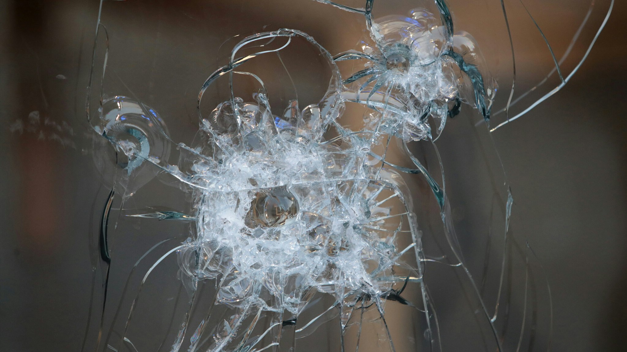 CHICAGO, ILLINOIS - AUGUST 10: A broken storefront window is seen after parts of the city had widespread looting and vandalism, on August 10, 2020 in Chicago, Illinois. Police made several arrests during the night of unrest and recovered at least one firearm. (Photo by Scott Olson/Getty Images)