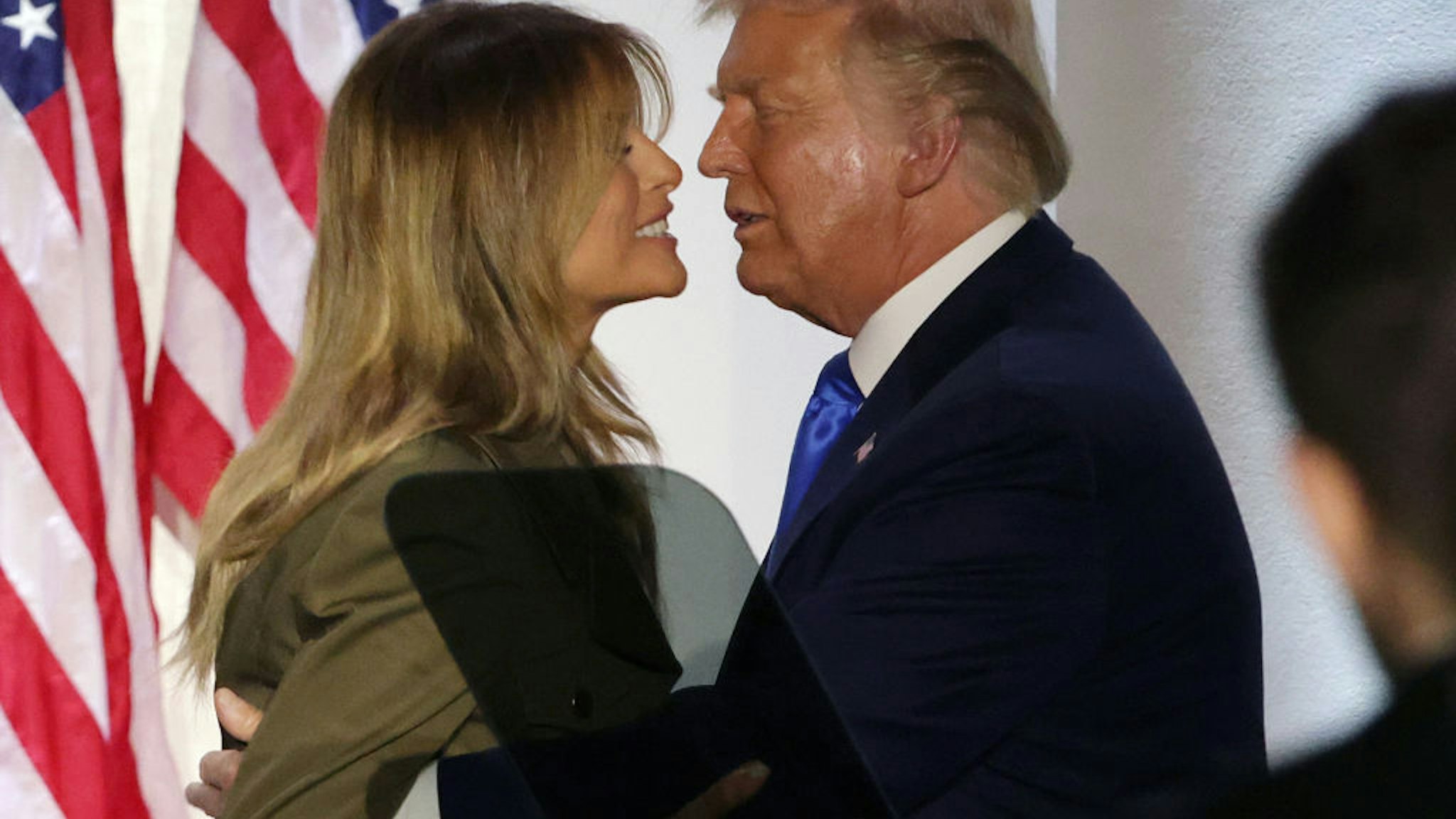 U.S. President Donald Trump and first lady Melania Trump embrace after she addressed the Republican National Convention from the Rose Garden at the White House on August 25, 2020 in Washington, DC.