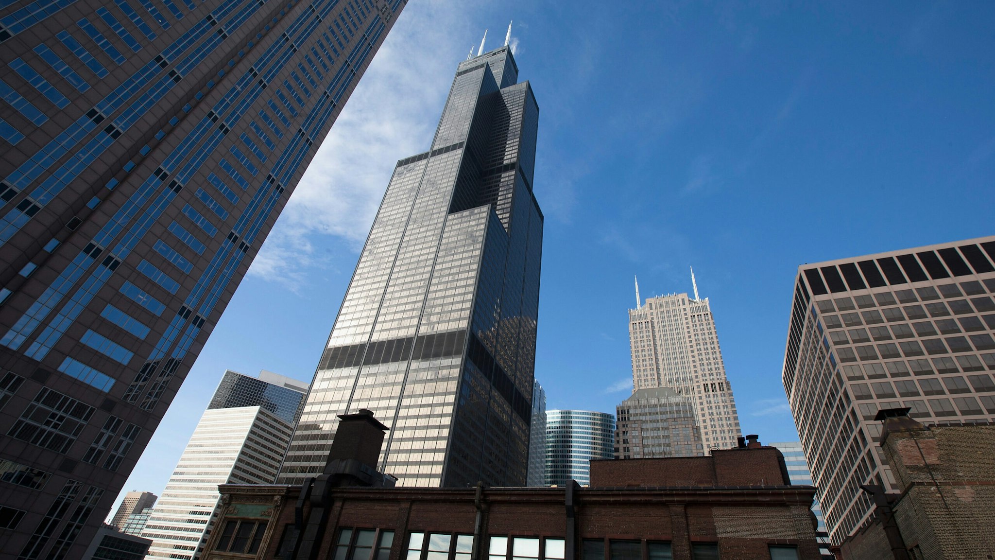 HICAGO, IL - MARCH 04: The Willis Tower (C), formerly known as the Sears Tower, dominates the southern end of the downtown skyline on March 4, 2015 in Chicago, Illinois. The building, completed in 1973, was the world's tallest for more than two decades. It is reported to be up for sale with an asking price of $1.5 billion. (Photo by Scott Olson/Getty Images)
