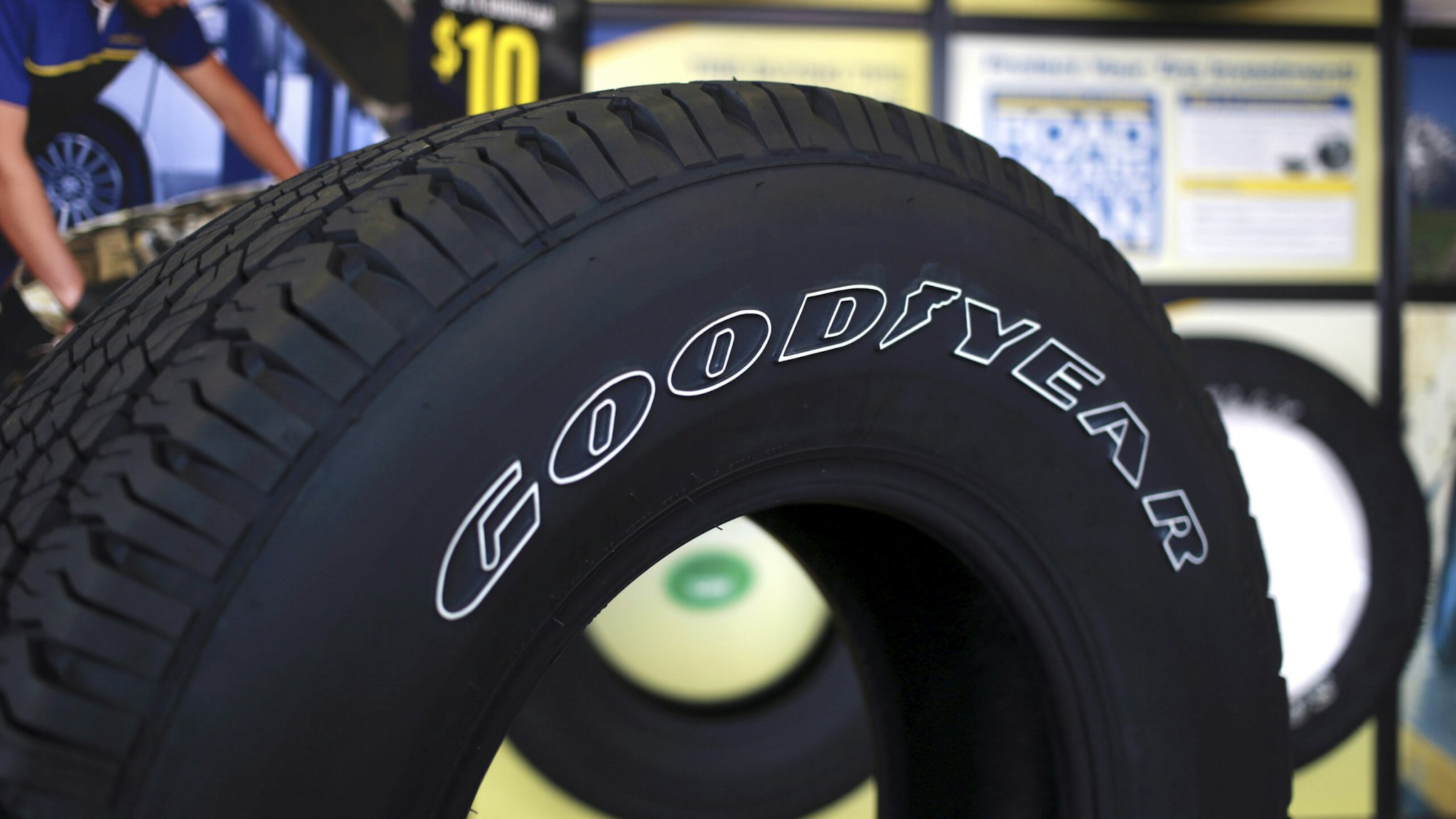 A Goodyear Tire and Rubber Co. brand tire is displayed for sale at one of the company's auto service centers in Millington, Tennessee, U.S., on Tuesday, Feb. 17, 2015. The Goodyear Tire &amp; Rubber Co. reported fourth-quarter sales of $4.48 billion and reaffirmed an earnings growth target of ten to fifteen percent for 2015.