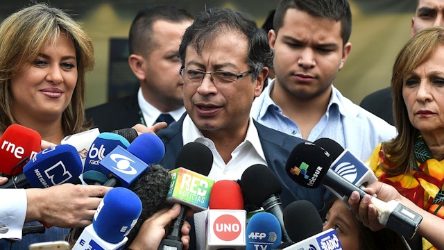 Presidential candidate Gustavo Petro talks to journlists after casting his vote at a polling station during the second round of the presidential elections in Bogota, Colombia on June 17, 2018 - Polls opened Sunday in Colombia for the presidential run-off election pitting conservative front-runner Ivan Duque against leftist former Bogota mayor and ex-guerrilla Gustavo Petro, the first since a peace deal with FARC rebels was signed.