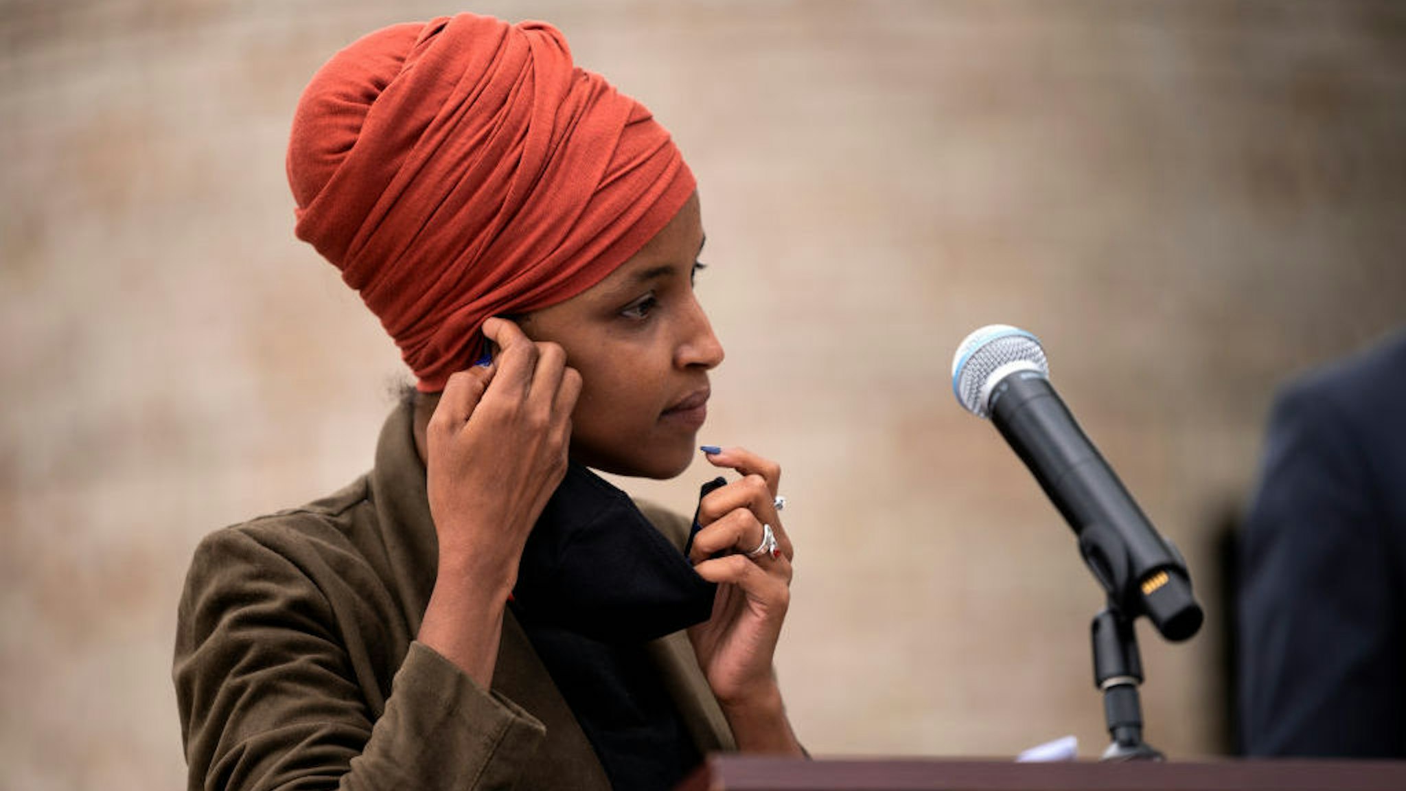 ST PAUL, MN - AUGUST 05: Rep. Ilhan Omar (D-MN) removes her mask to speak during a press conference outside the DFL Headquarters on August 5, 2020 in St Paul, Minnesota. Omar is hoping to retain her seat as the representative for Minnesota's 5th Congressional District in next week's primary election. (Photo by Stephen Maturen/Getty Images)