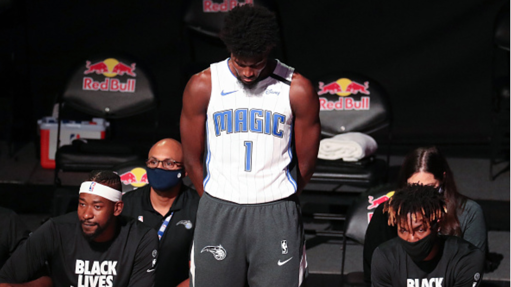 Orlando Magic forward Jonathan Isaac (1) is the lone player to stand and not wear a "Black Lives Matter" t-shirt prior to a game against the Brooklyn Nets at Disney's Wide World of Sports' HP Field House in Lake Buena Vista, Florida, on Friday, July 31, 2020.