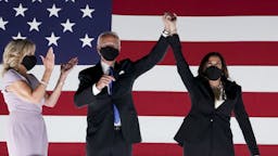 Joe Biden Accepts Presidential Nomination At Democratic National Convention Former Vice President Joe Biden, Democratic presidential nominee, second left, and Senator Kamala Harris, Democratic vice presidential nominee, wear protective masks while holding hands next to Jill Biden, left, outside the Chase Center during the Democratic National Convention in Wilmington, Delaware, U.S., on Thursday, Aug. 20, 2020. Biden accepted the Democratic nomination to challenge President Donald Trump, urging Americans in a prime-time address to vote for new national leadership that will overcome deep U.S. political divisions. Photographer: Stefani Reynolds/Bloomberg