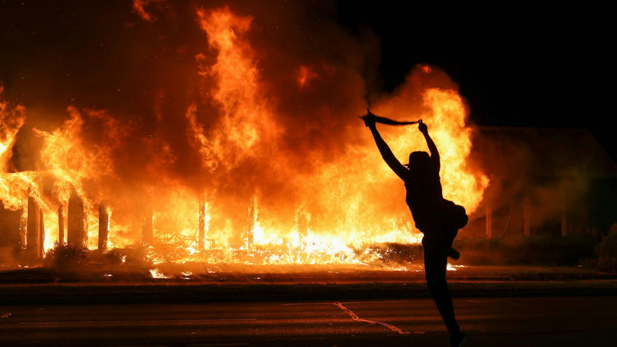 Jacob Blake protesters lit buildings on fire in Kenosha, Wisconsin, United States on August 24, 2020. A police shooting in the US state of Wisconsin sent a Black man into serious condition on Sunday, with the video footage of the incident triggering outrage. (Photo by Tayfun Coskun/Anadolu Agency via Getty Images)