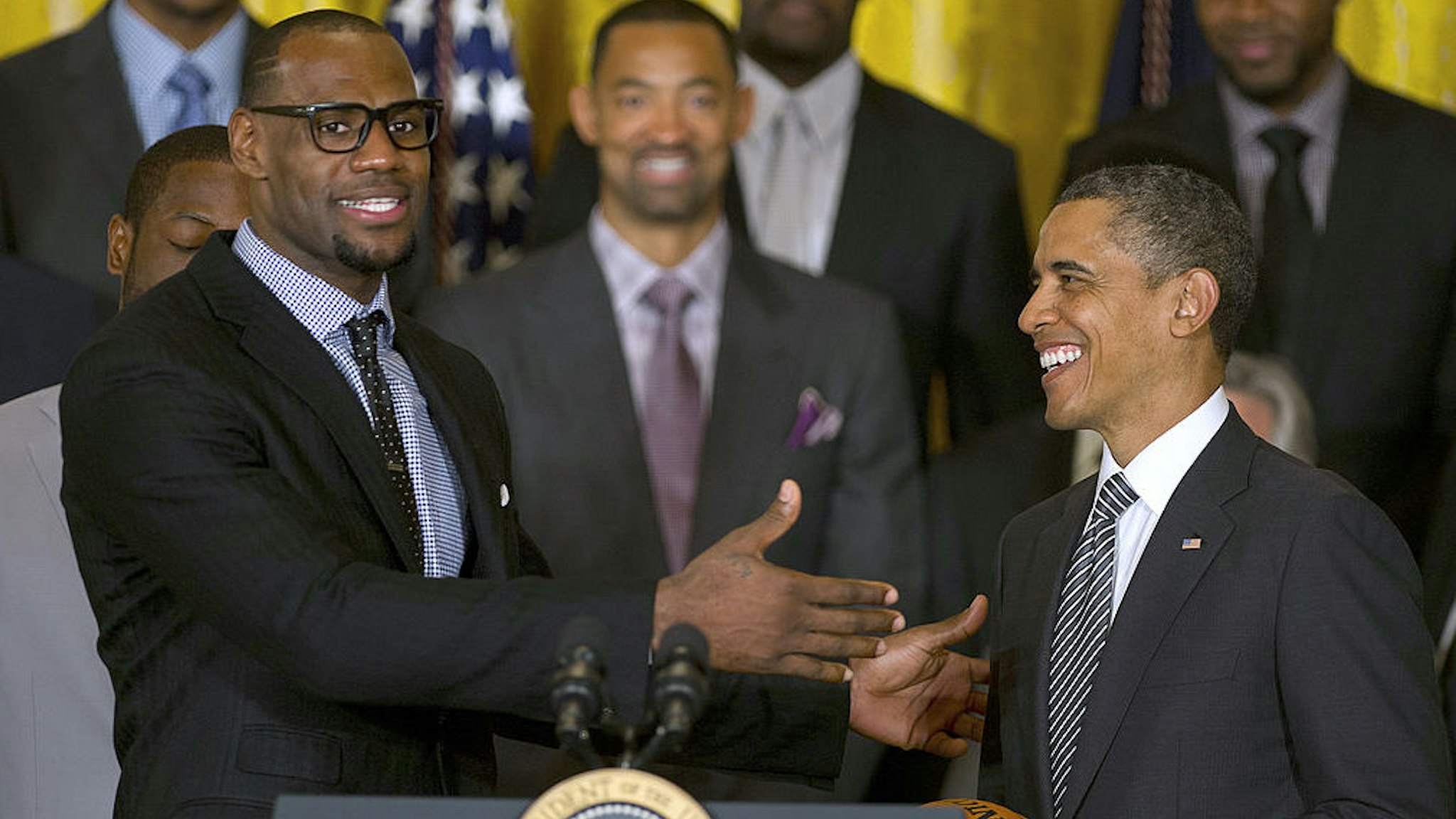 US President Barack Obama (R) poses with LeBron James as he welcomes the NBA Champion Miami Heat to the White House to honor the team and their 2012 NBA Championship victory at the White House in Washington, DC, January 28, 2013. (Jim Watson/AFP via Getty Images)