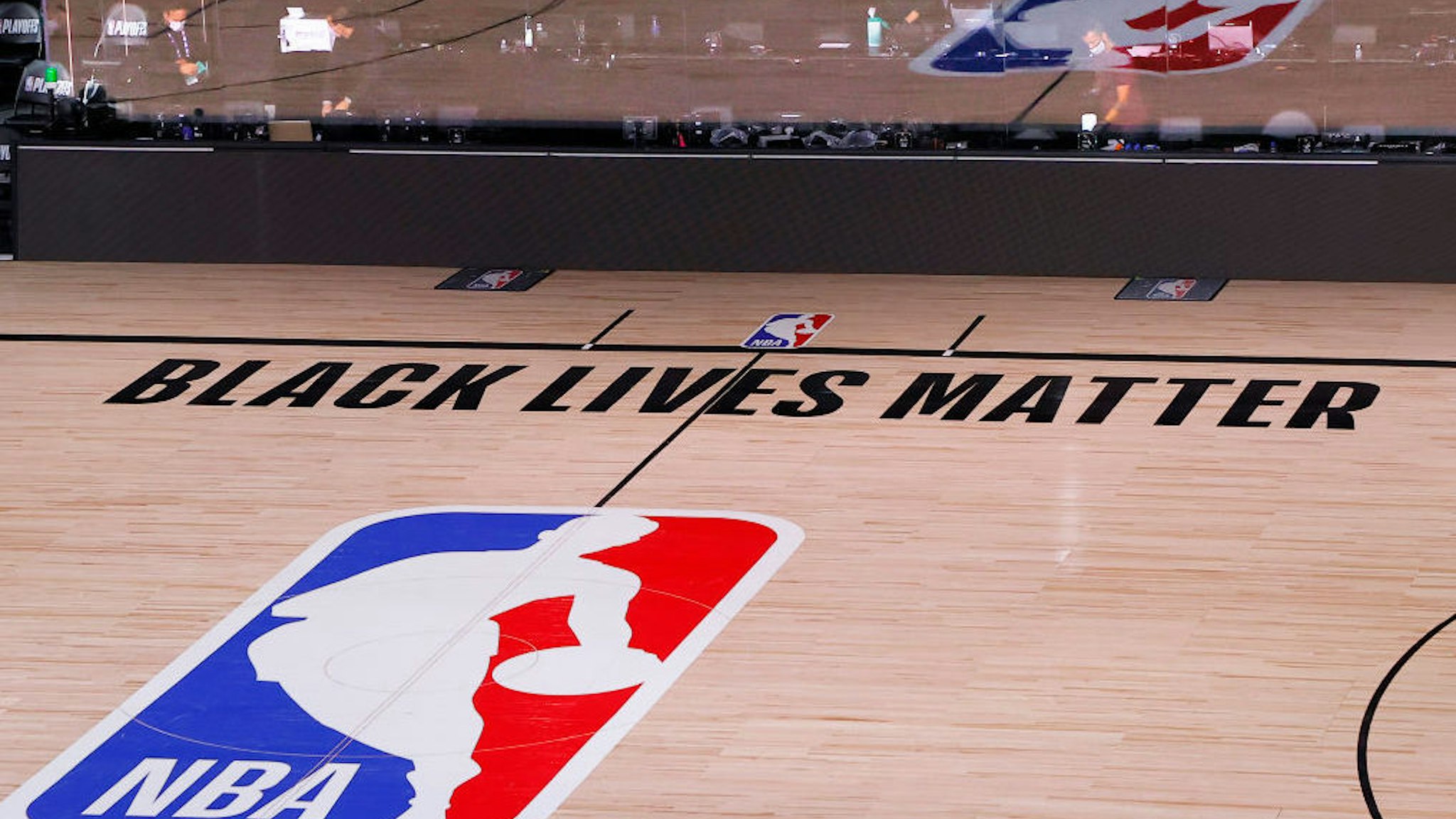LAKE BUENA VISTA, FLORIDA - AUGUST 26: An empty court and bench is shown with no signage following the scheduled start time in Game Five of the Eastern Conference First Round between the Milwaukee Bucks and the Orlando Magic during the 2020 NBA Playoffs at AdventHealth Arena at ESPN Wide World Of Sports Complex on August 26, 2020 in Lake Buena Vista, Florida. The Milwaukee Buck have boycotted game 5 reportedly to protest the shooting of Jacob Blake in Kenosha, Wisconsin.