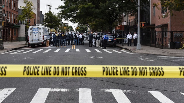 A crime scene is established in front of the Triple A Aces social club on Utica Avenue on October 12, 2019 in New York City. At least four people were declared dead and three others wounded in an early morning gun fight at an illegal gambling location, according to the NYPD. (Photo by Stephanie Keith/Getty Images)