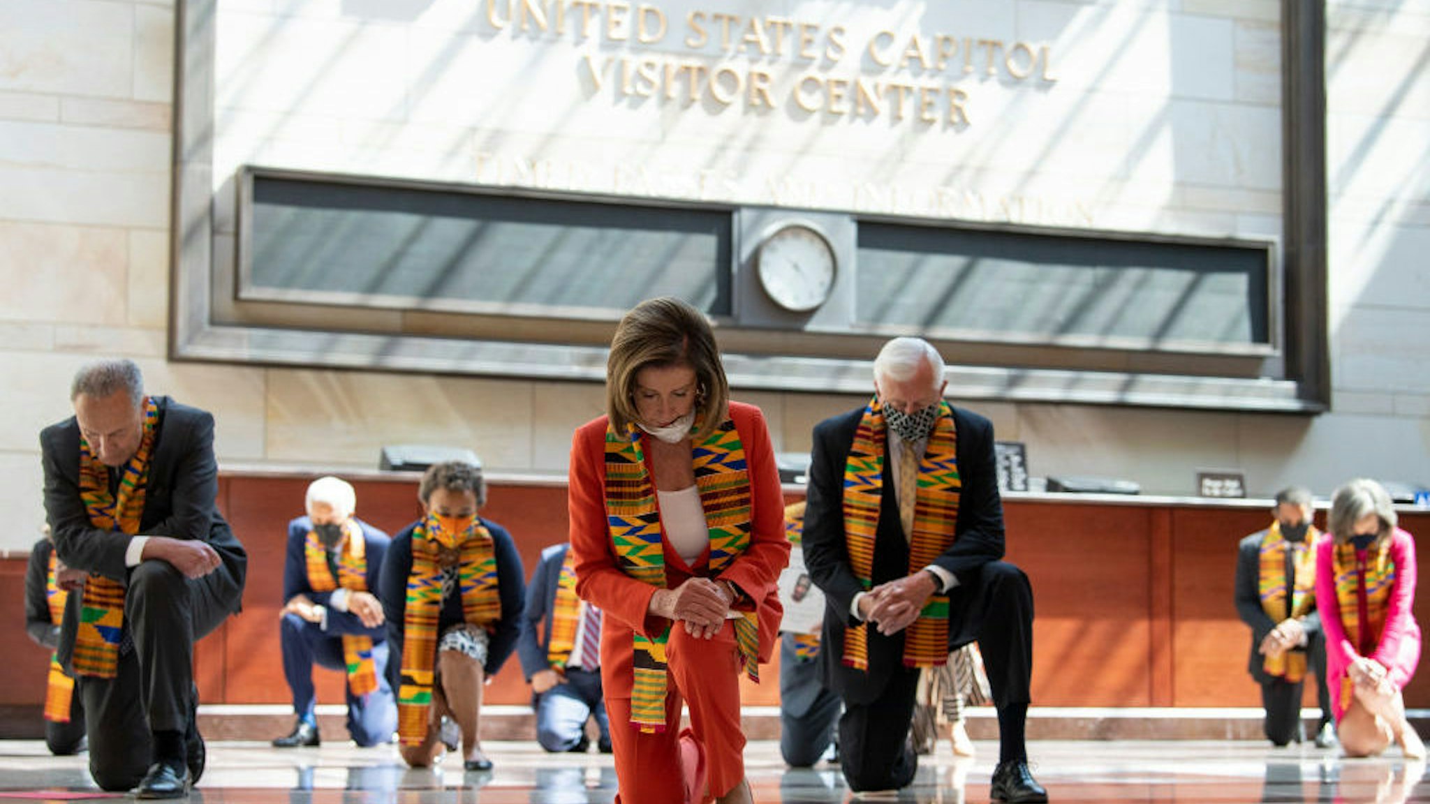 UNITED STATES - JUNE 8: Speaker of the House Nancy Pelosi, D-Calif., and other members of Congress gather at the Emancipation Hall, kneel as they take moment of silence to honor George Floyd, and victims of racial injustice on Monday, June 8, 2020. (Photo by Caroline Brehman/CQ Roll Call)